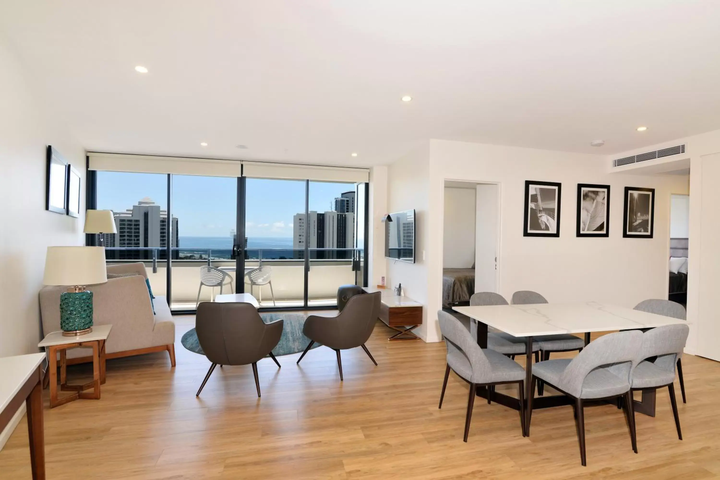 Living room, Dining Area in Ruby Gold Coast by CLLIX