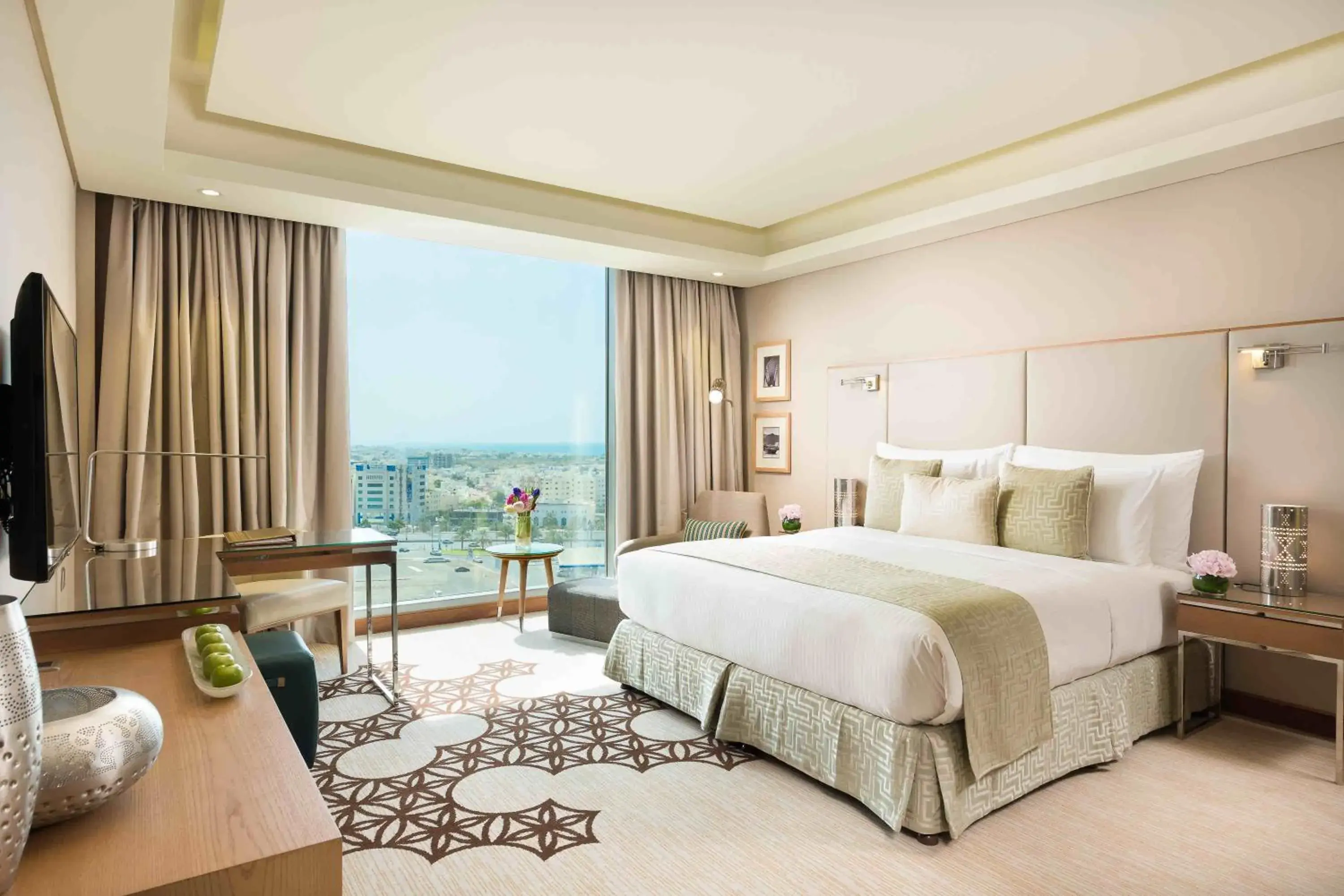 Photo of the whole room, Bed in Grand Millennium Muscat