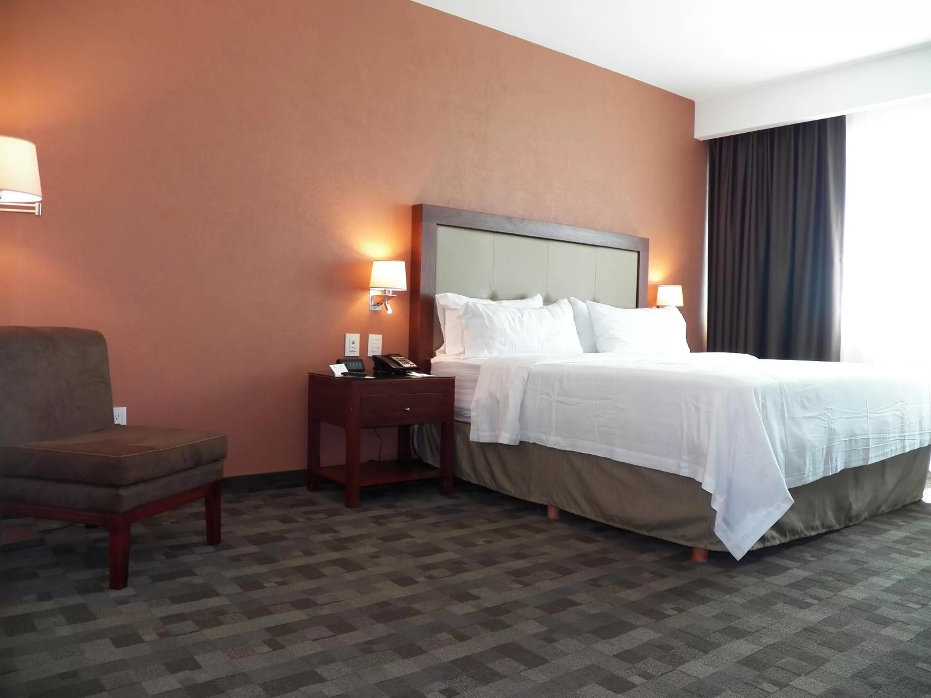 Bed in Holiday Inn & Suites Plaza Mayor by IHG