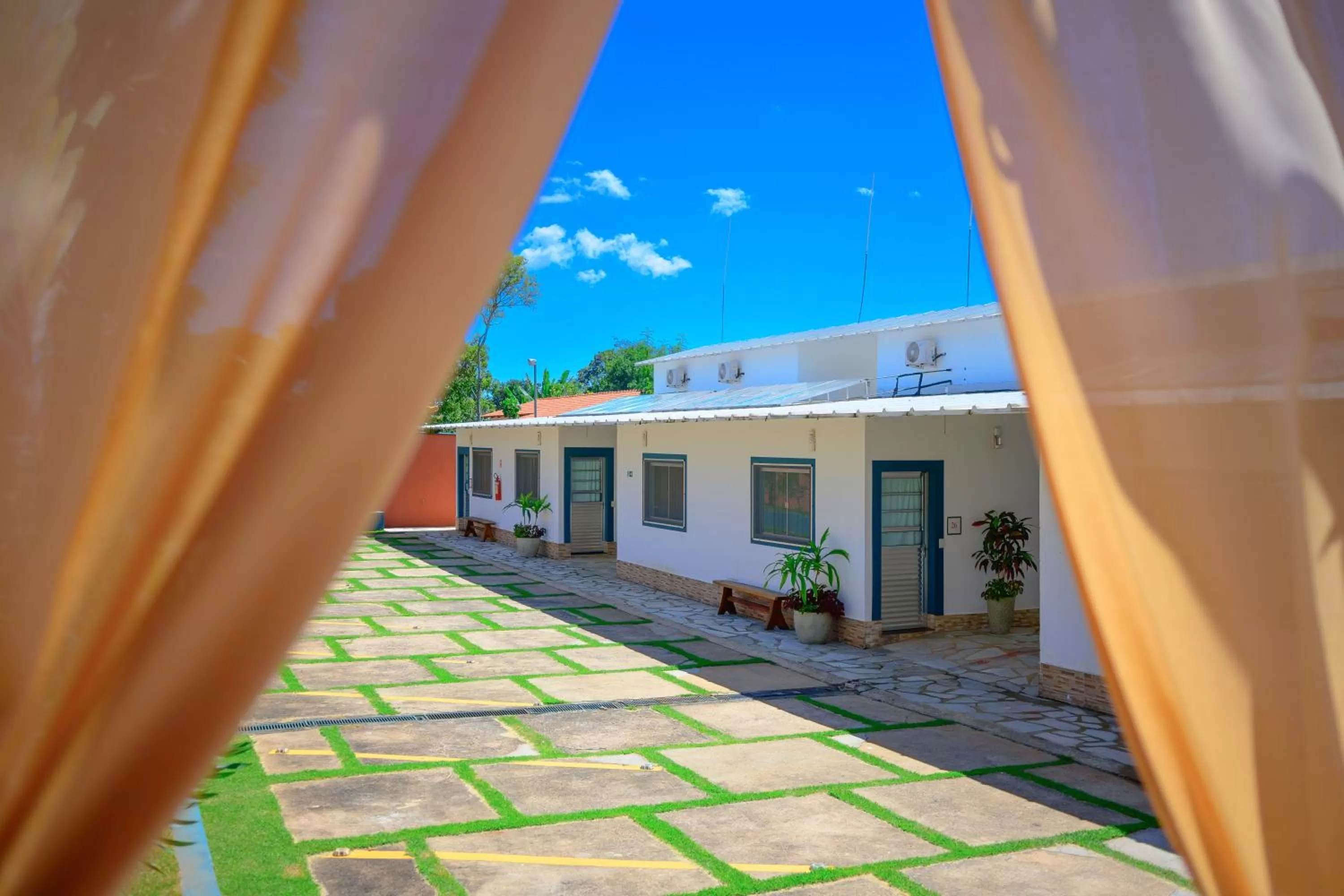 Bedroom in Villaê Pousada