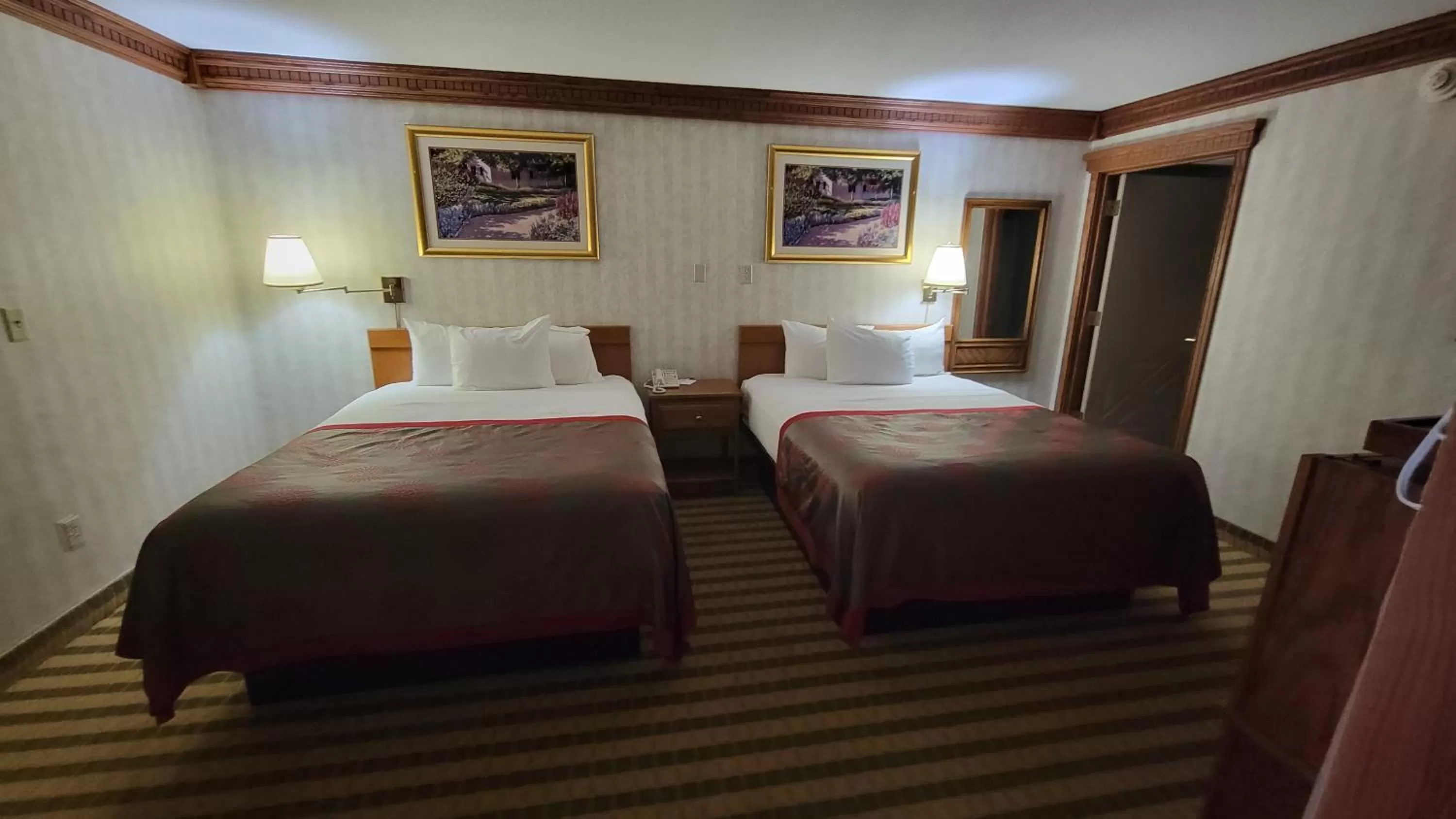 Bedroom, Bed in Ramada by Wyndham Saginaw Hotel & Suites