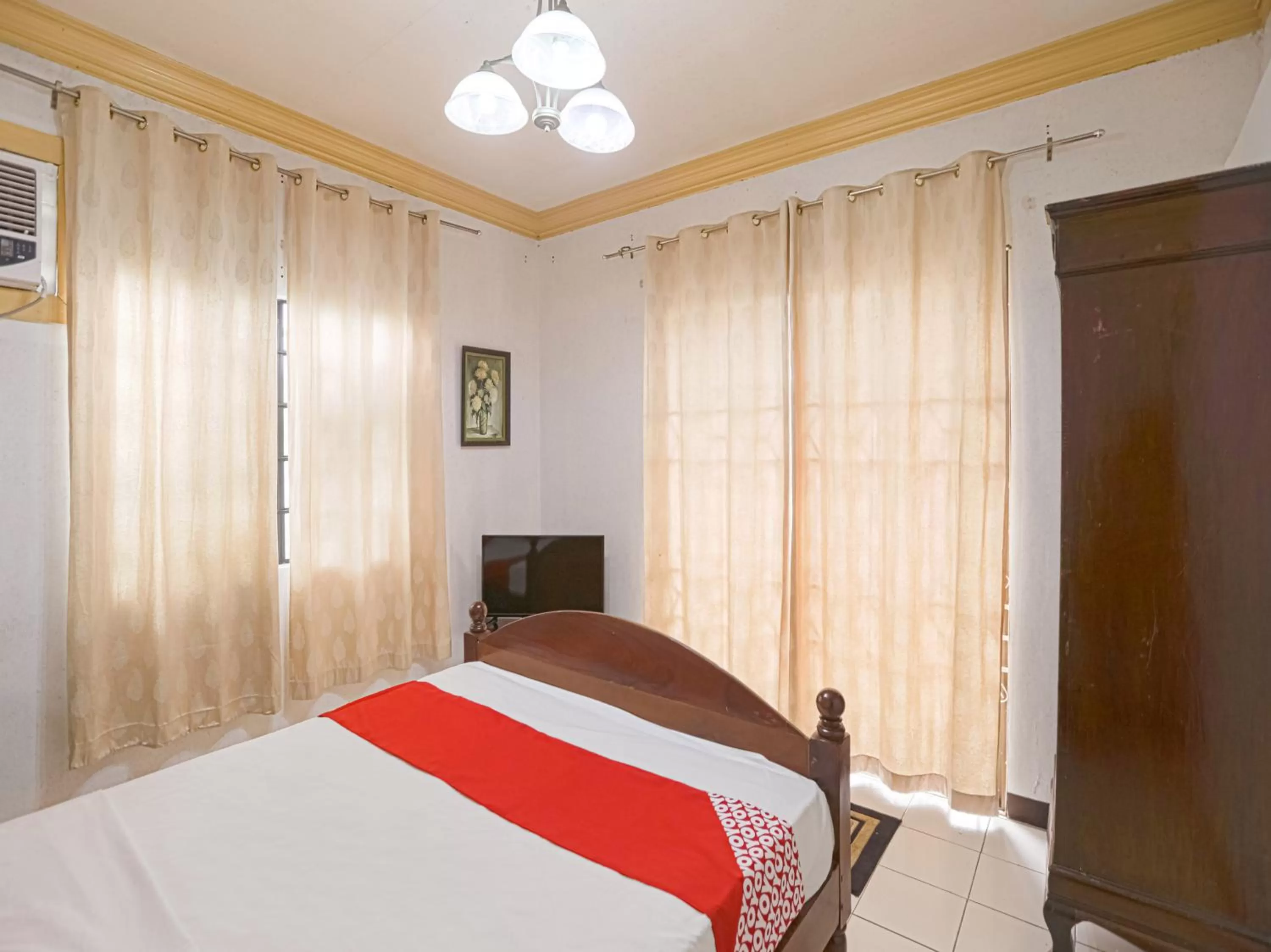 Bedroom, Bed in OYO 784 Laura's Garden Resort