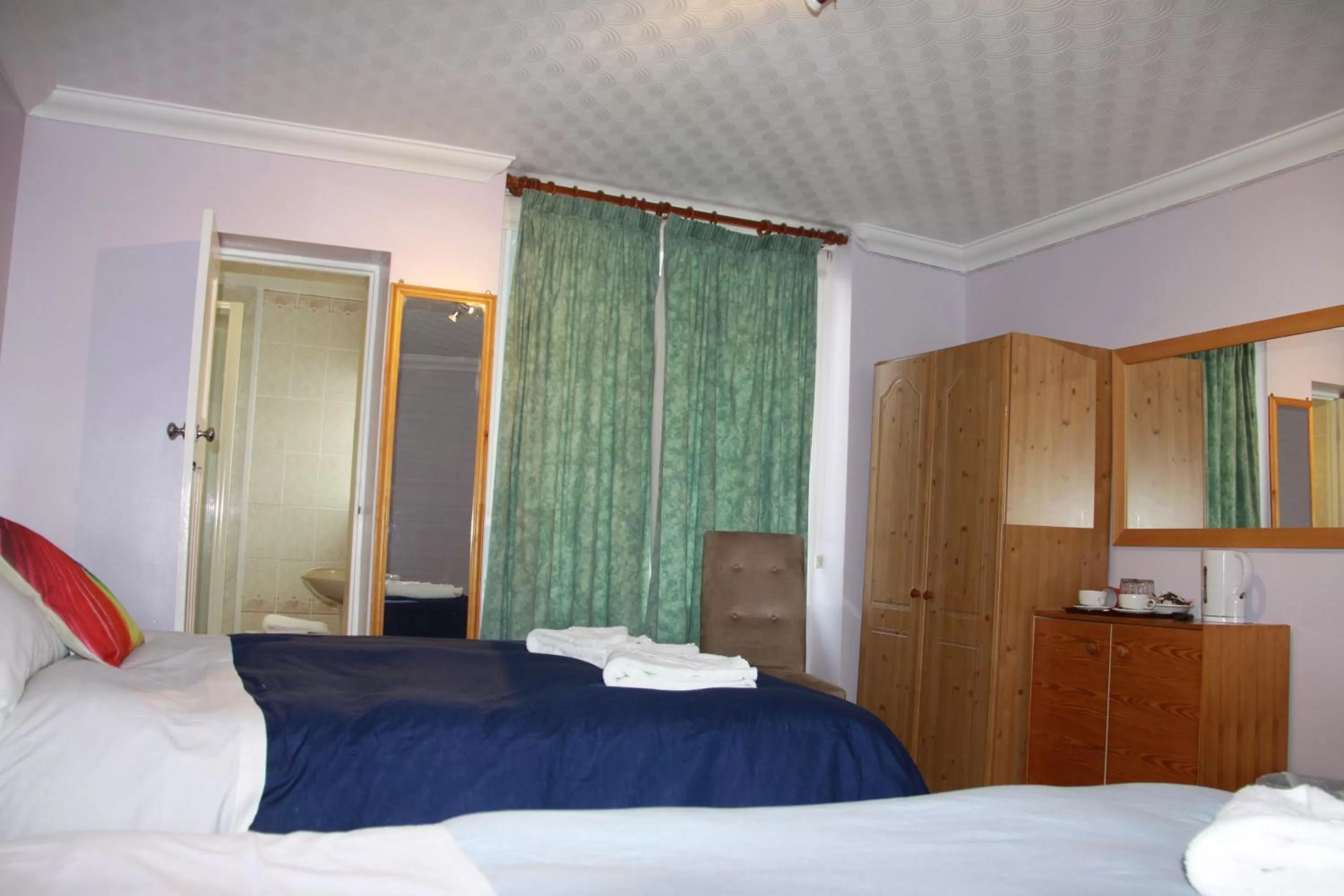 Bed in Ambassador Hotel