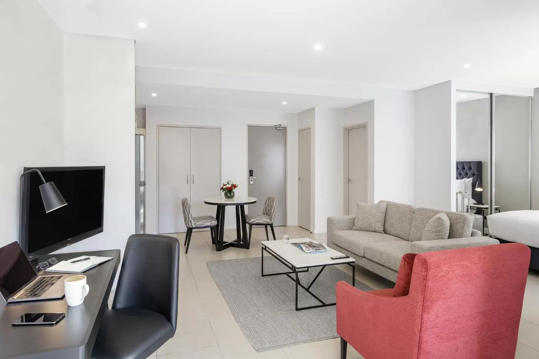 Bed, Seating Area in Meriton Suites Kent Street, Sydney