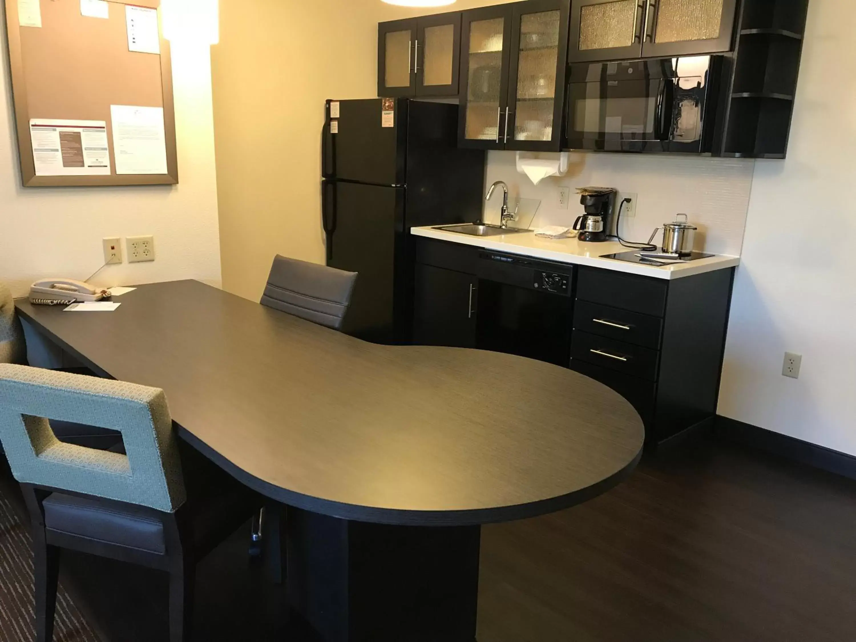 Photo of the whole room, Kitchen/Kitchenette in Candlewood Suites Fort Wayne - NW, an IHG Hotel
