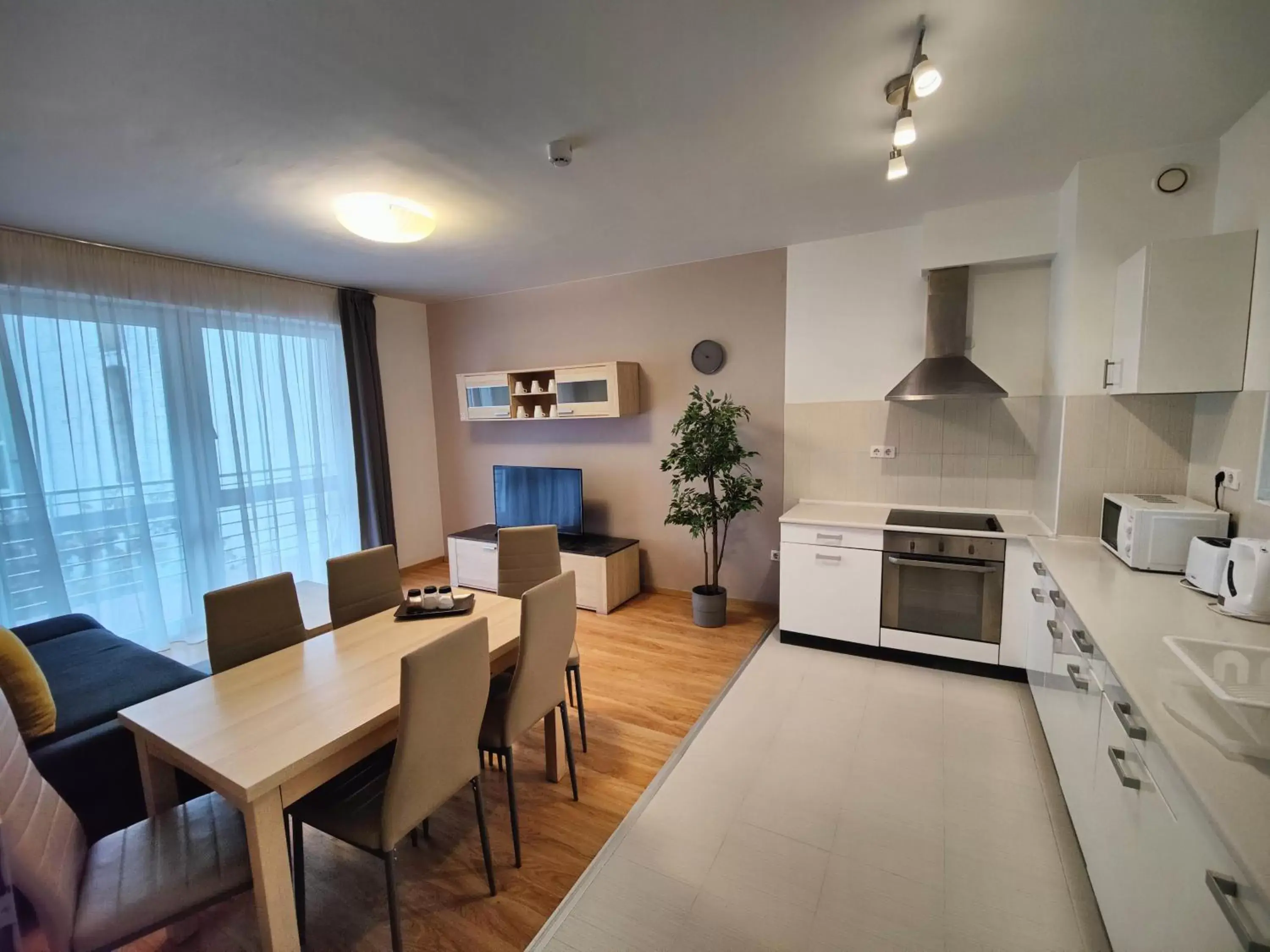 Living room, Dining Area in Corvin Plaza Apartments & Suites