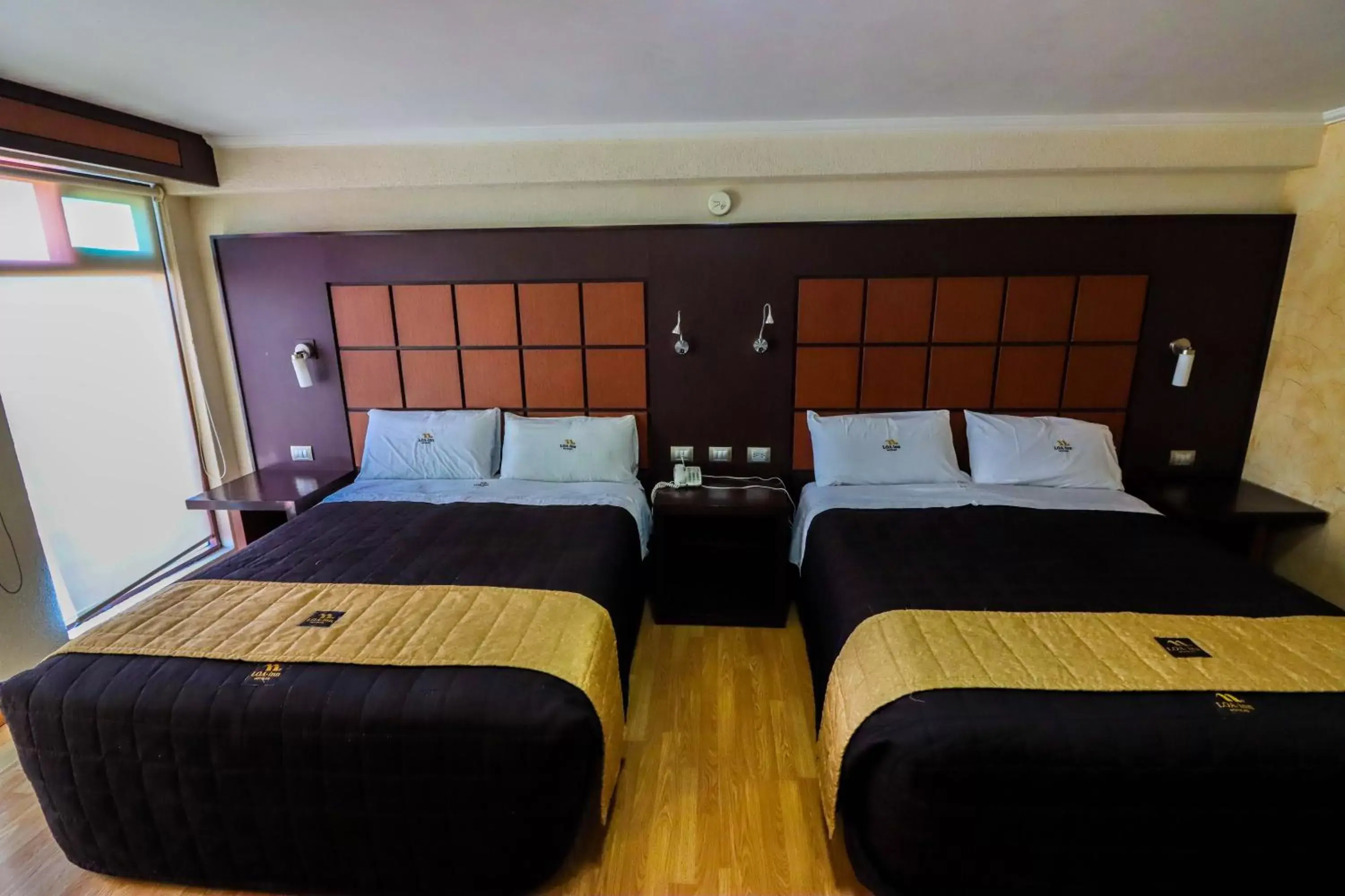 Photo of the whole room, Bed in Loa Inn Centro Puebla