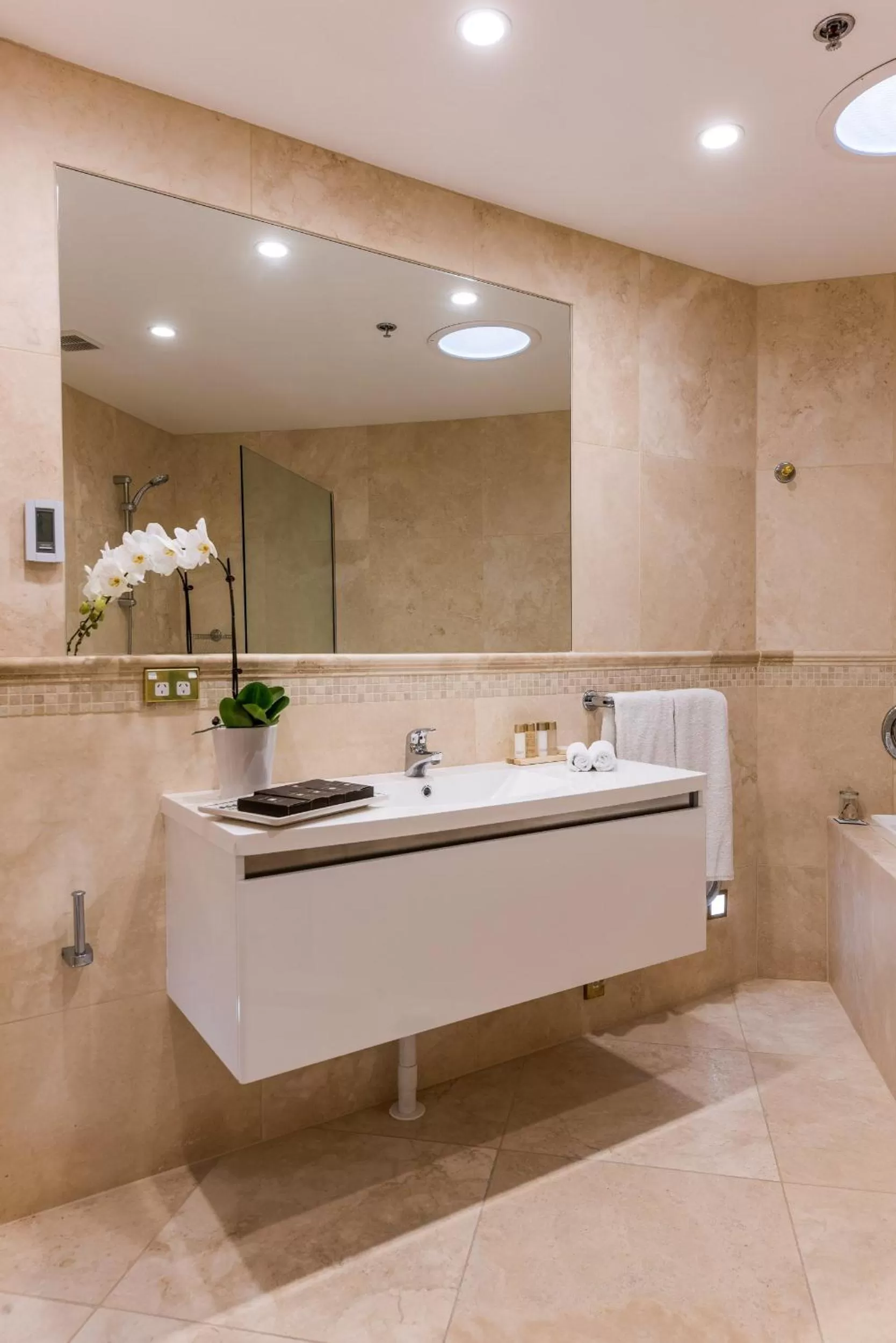 Bathroom in Fino Hotel & Suites