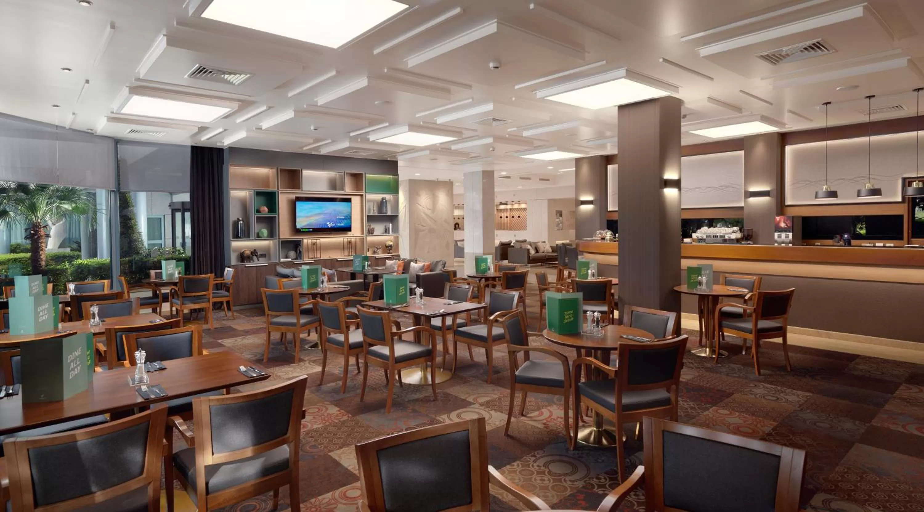Lounge or bar in Holiday Inn Athens Attica Av, Airport W. by IHG