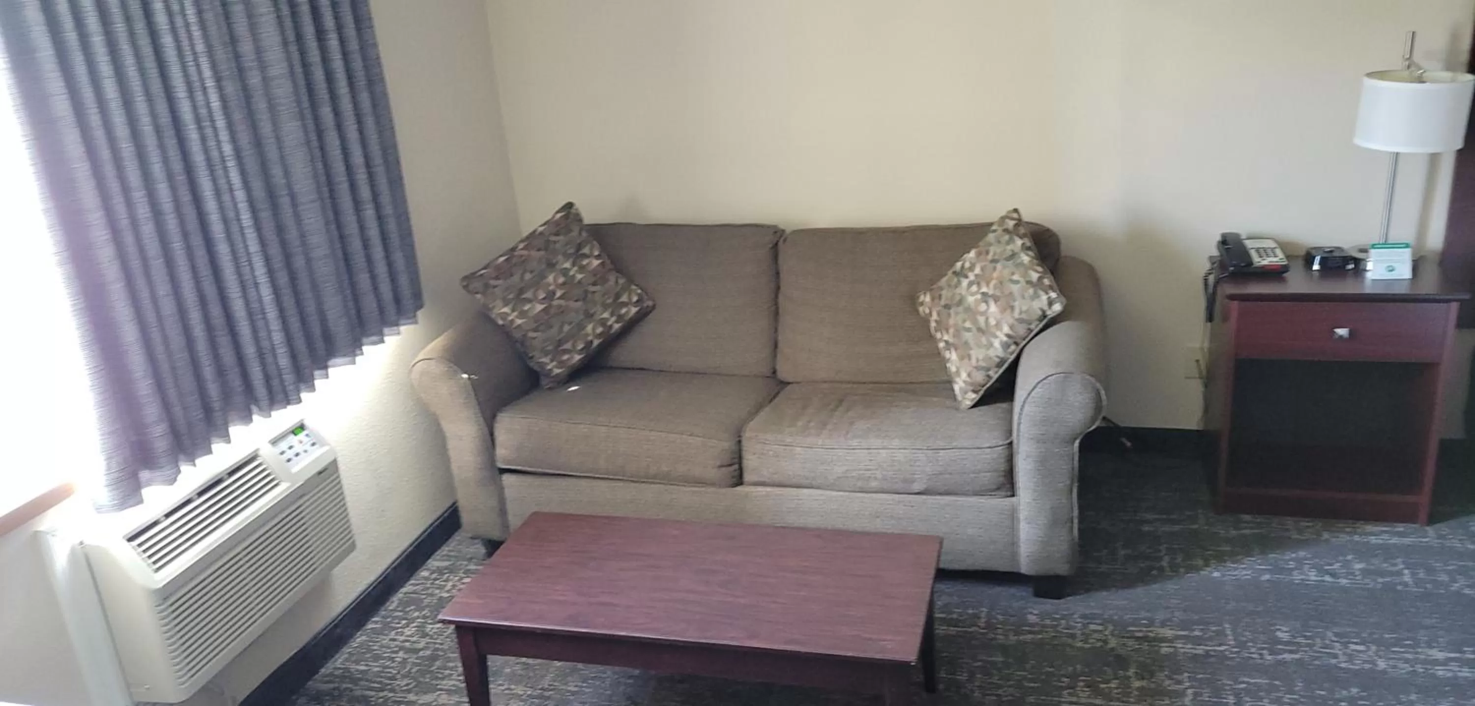 Seating area in Boarders Inn & Suites by Cobblestone Hotels - Broken Bow