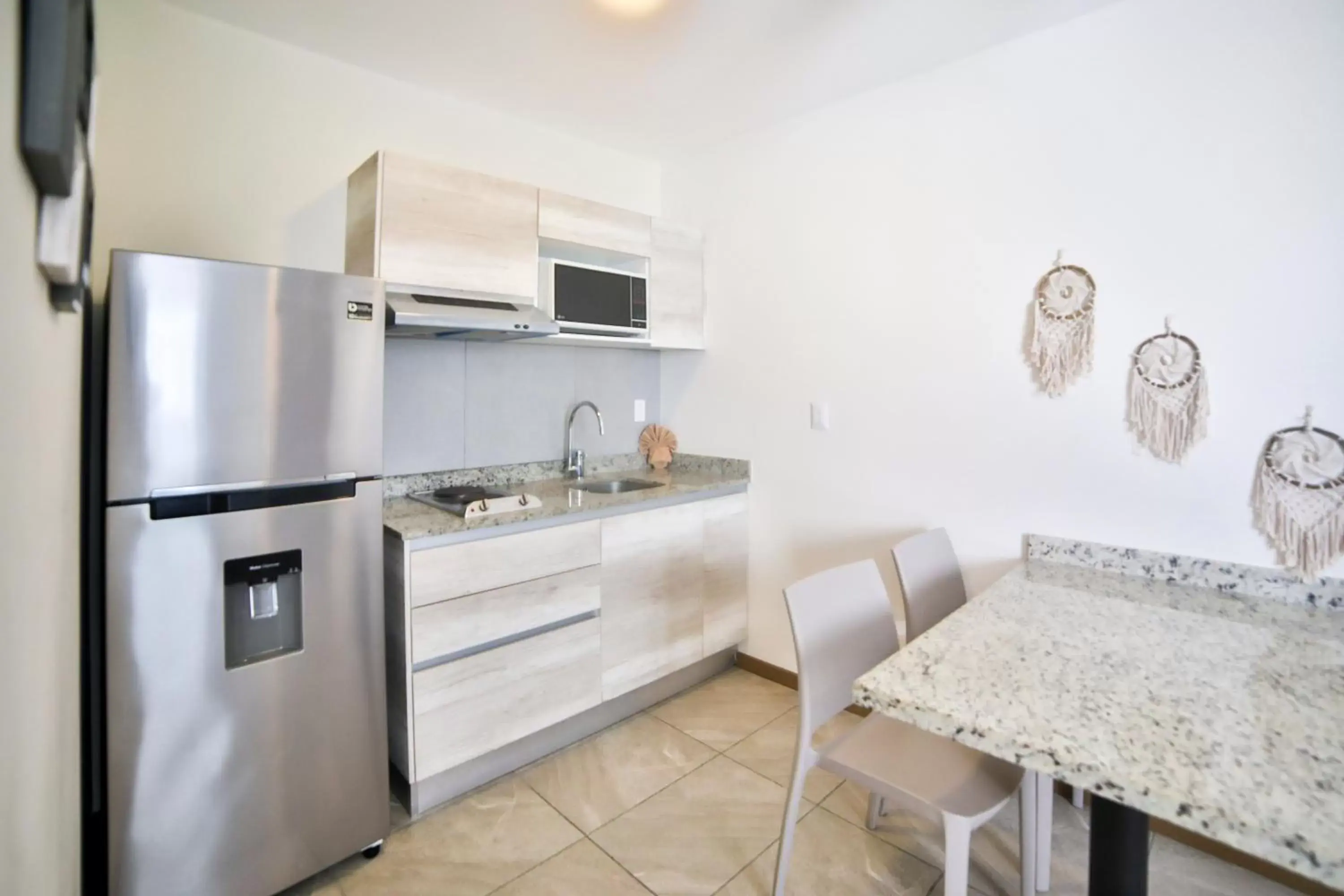 Kitchen/Kitchenette in Grand Fifty Suites