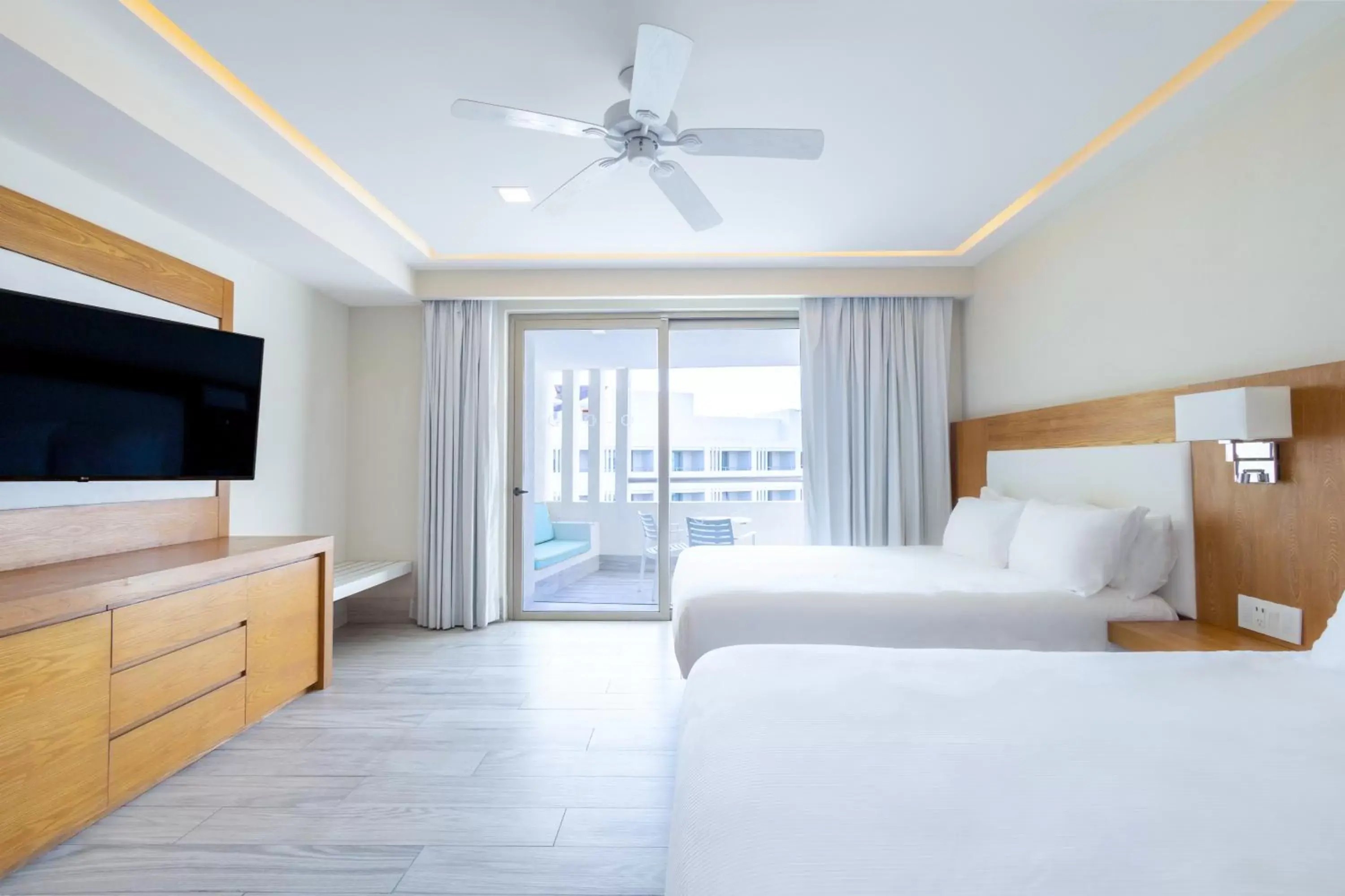 Bedroom, TV/Entertainment Center in Izla Beach Front Hotel