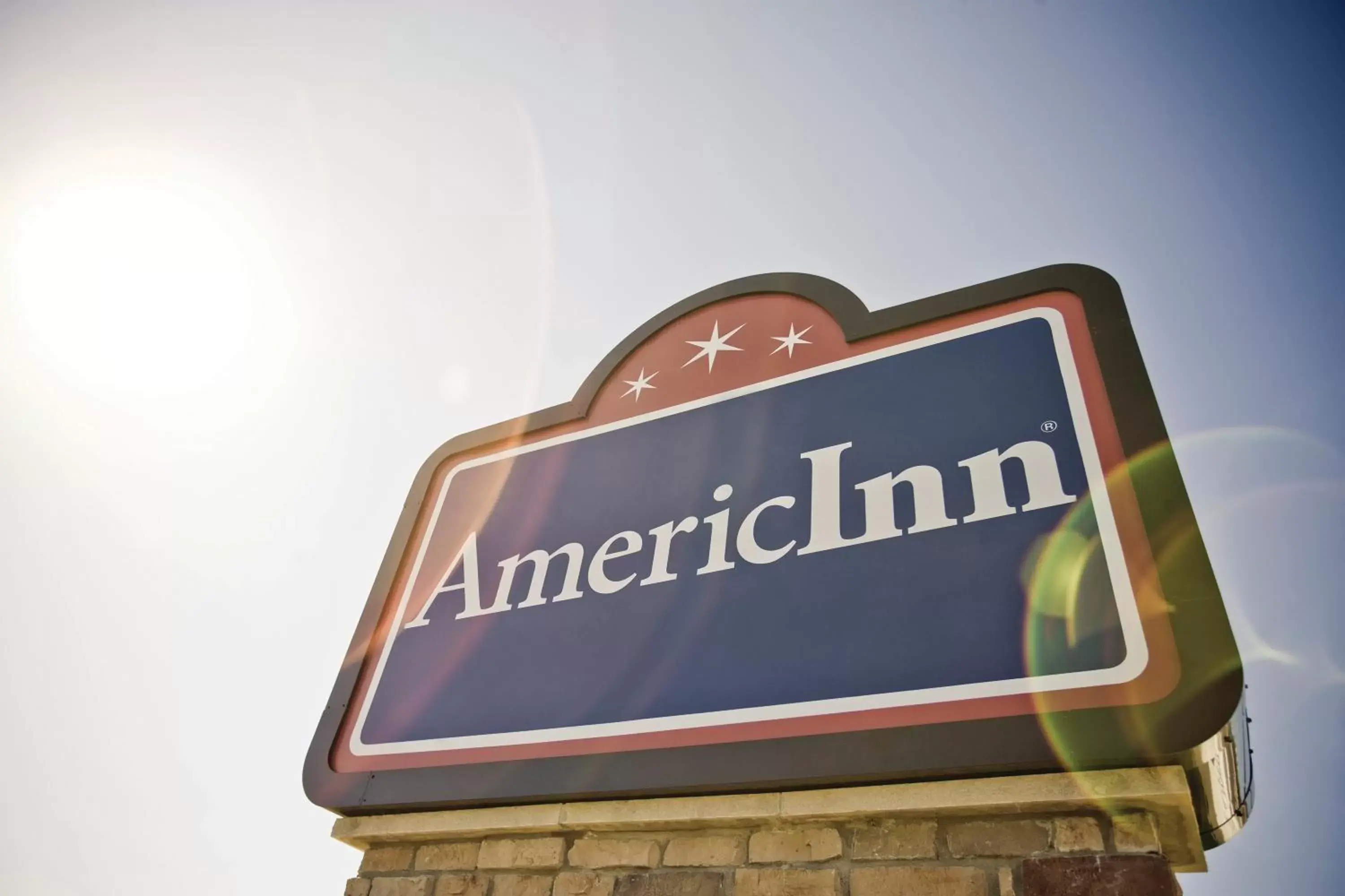 Property logo or sign in AmericInn by Wyndham DeWitt