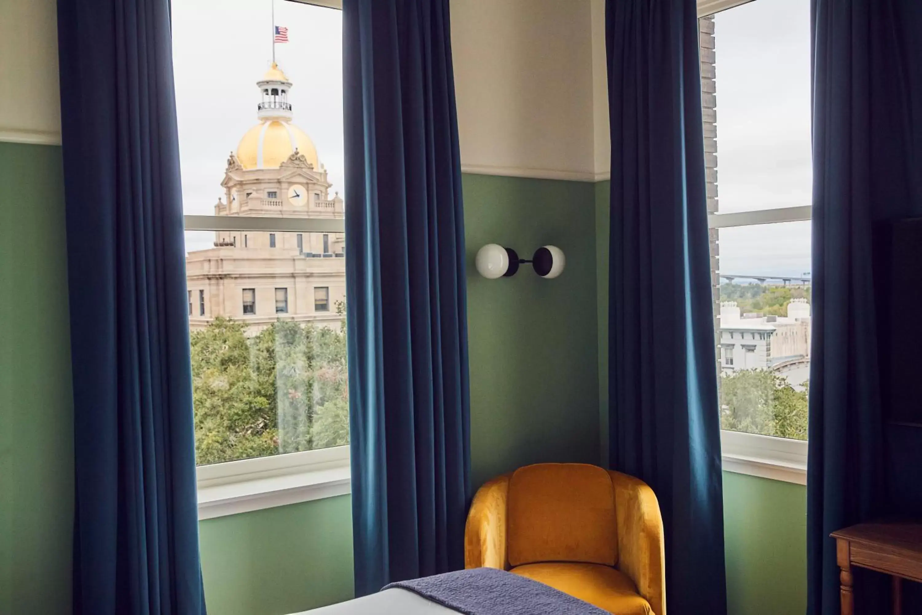 Seating area, Bed in The Drayton Hotel Savannah, Curio Collection by Hilton Seating area, Bed in The Drayton Hotel Savannah, Curio Collection by Hilton