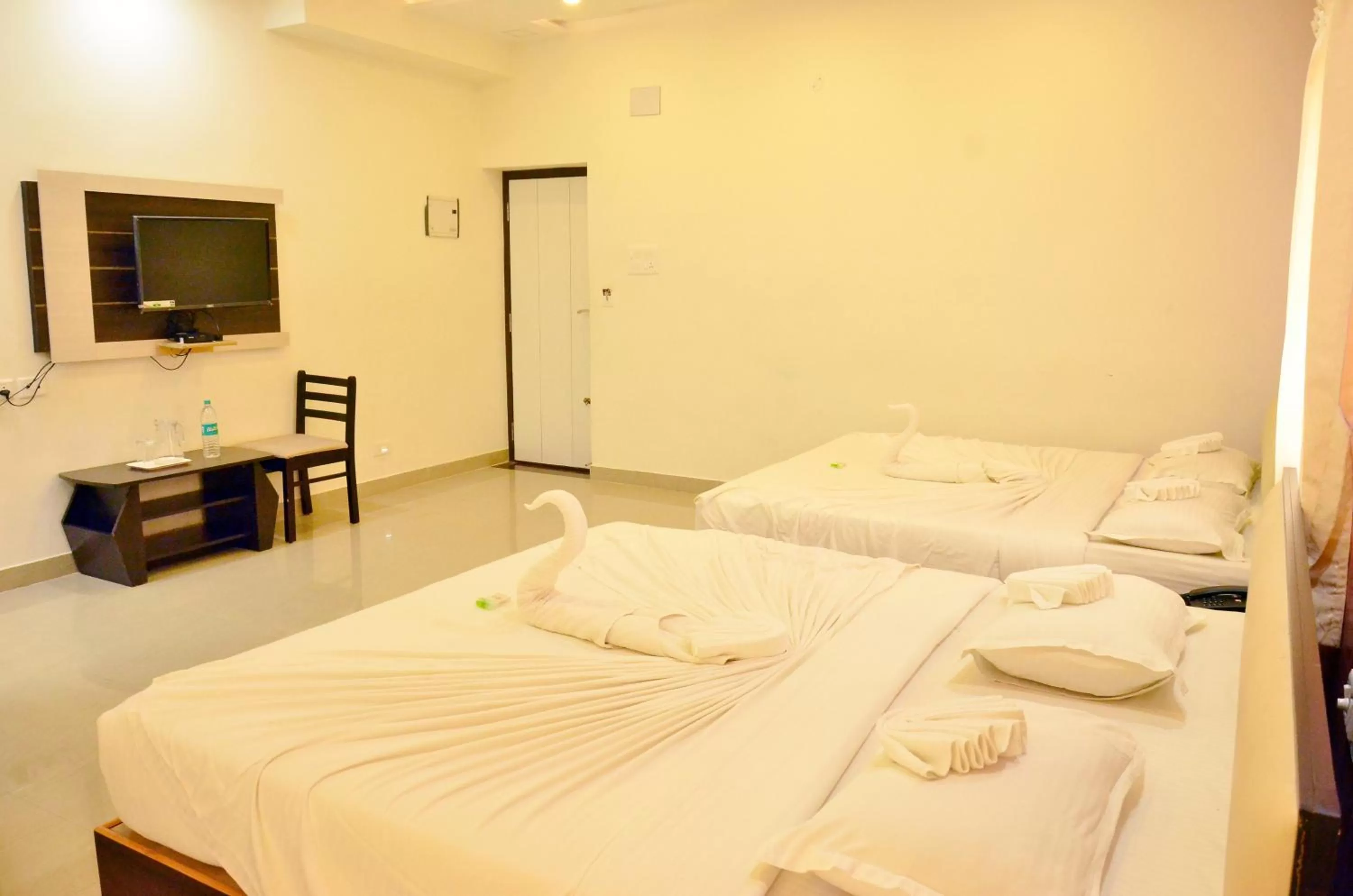 Bed in Hotel Ambai Grand