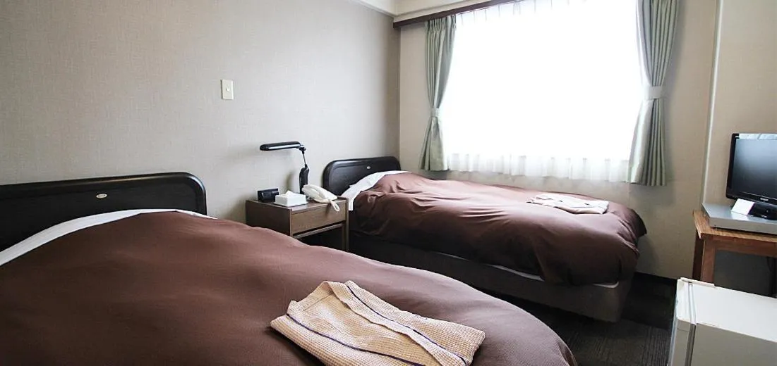 Bed in Takamatsu City Hotel