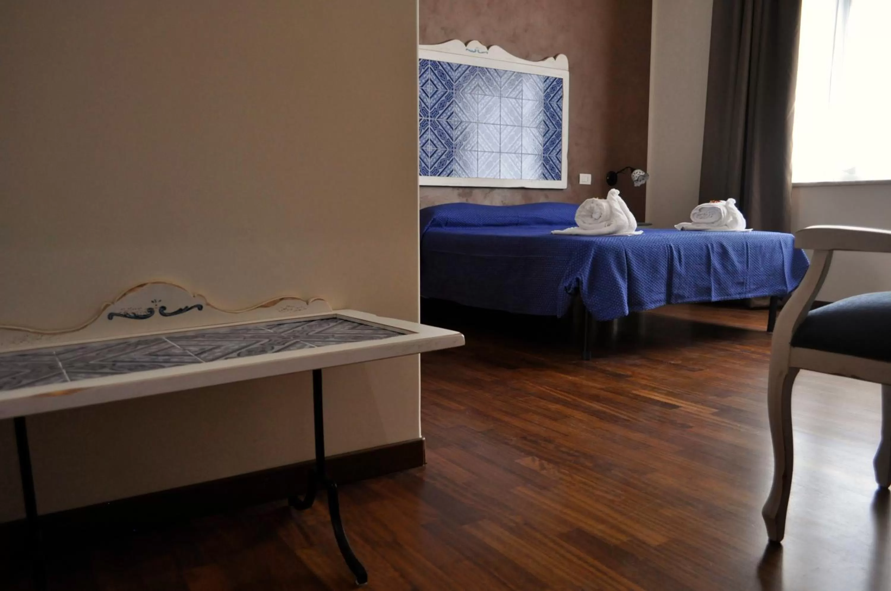 Decorative detail, Bed in Stupor Mundi Bed and Breakfast