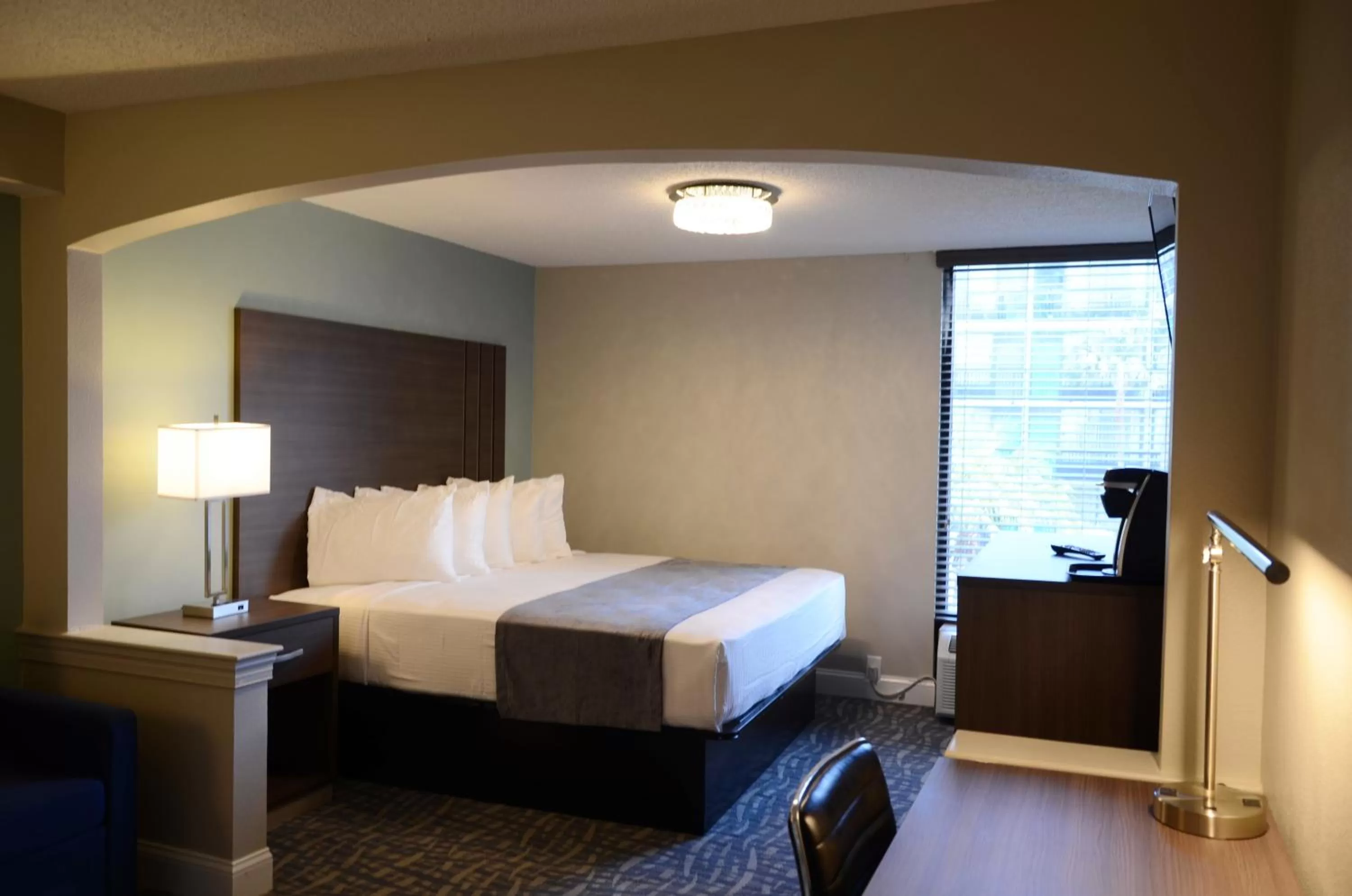 Bed in Opal Hotel & Suites