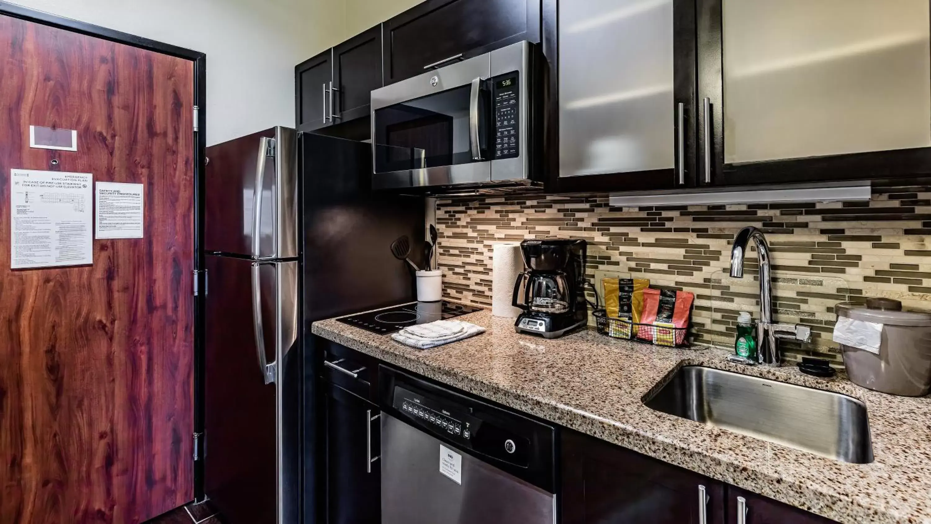 Photo of the whole room, Kitchen/Kitchenette in Staybridge Suites Laredo, an IHG Hotel