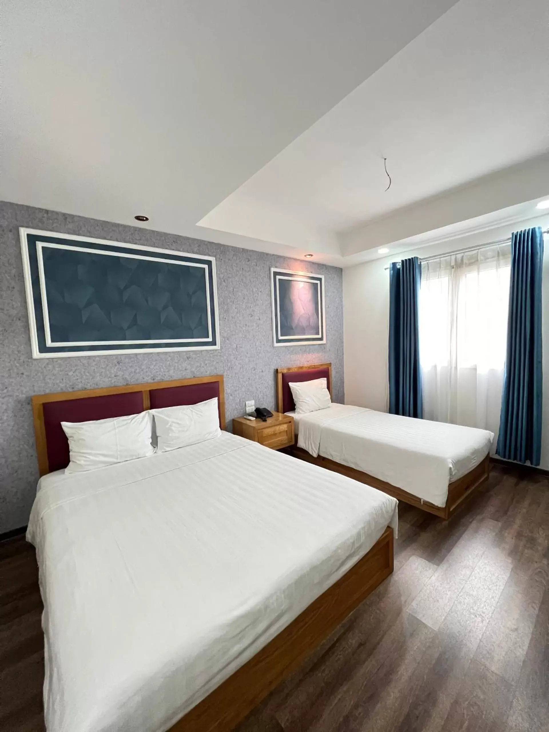 Bed in Holiday Suites Hotel & Spa