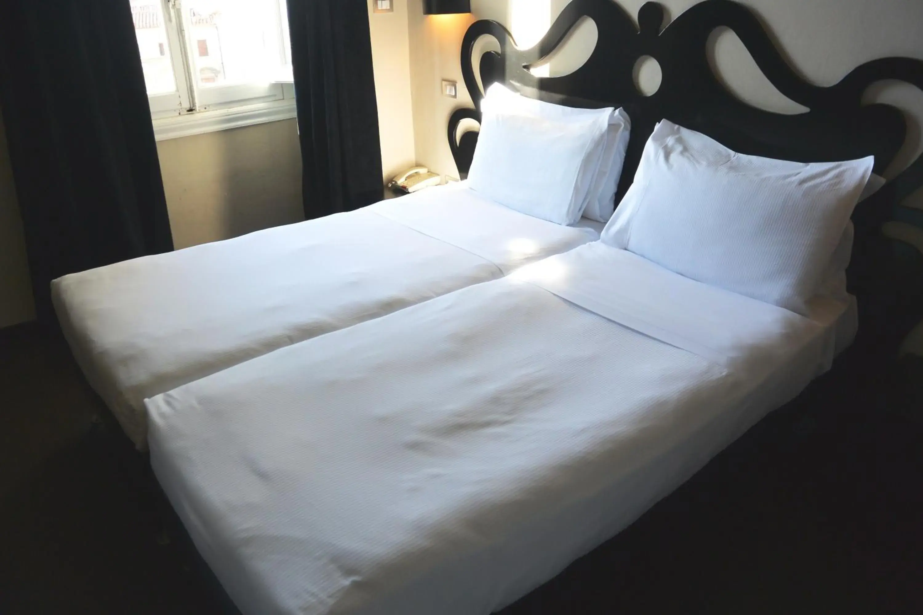 Bed in Hotel Universo - WTB Hotels