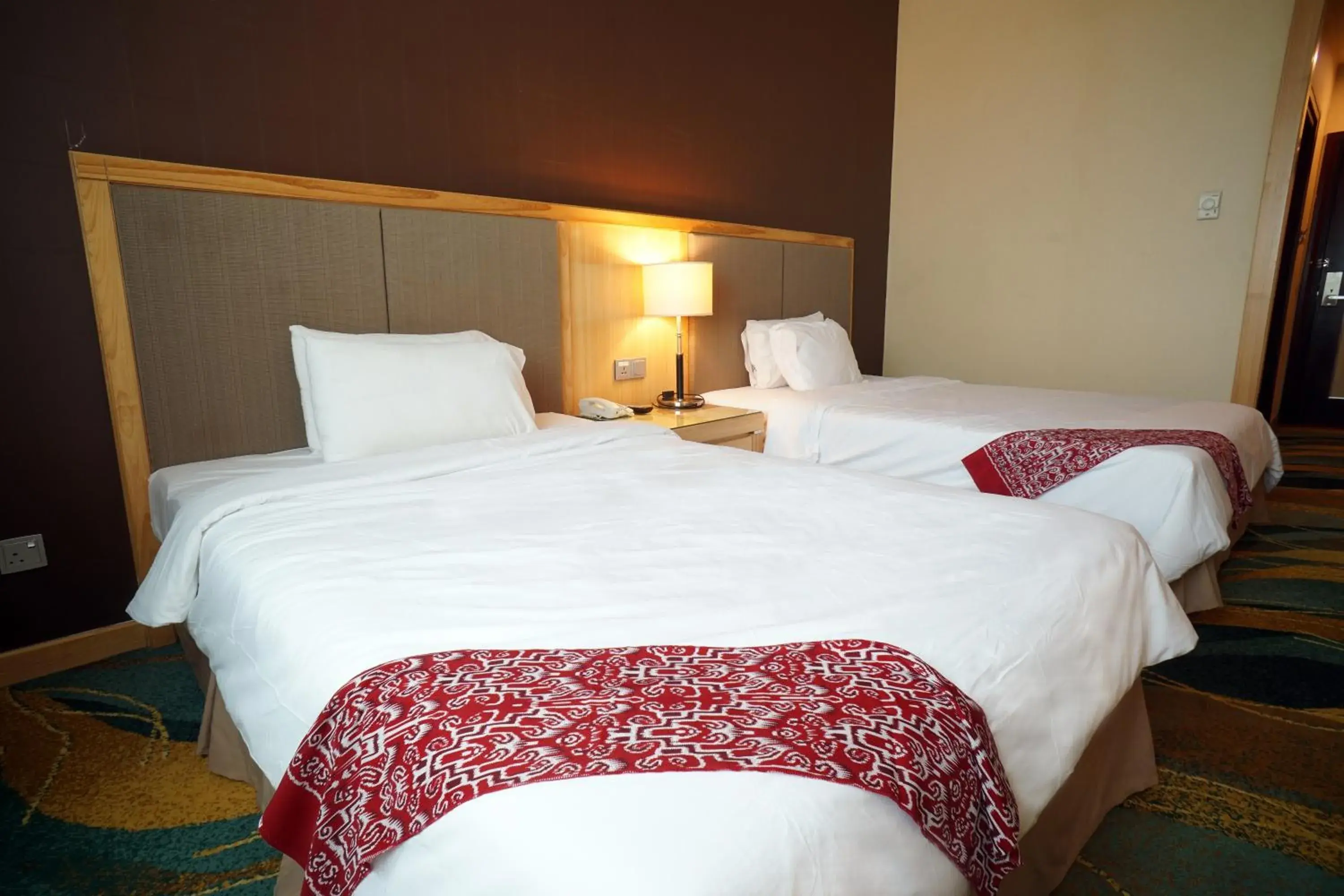 Bed in Imperial Palace Hotel