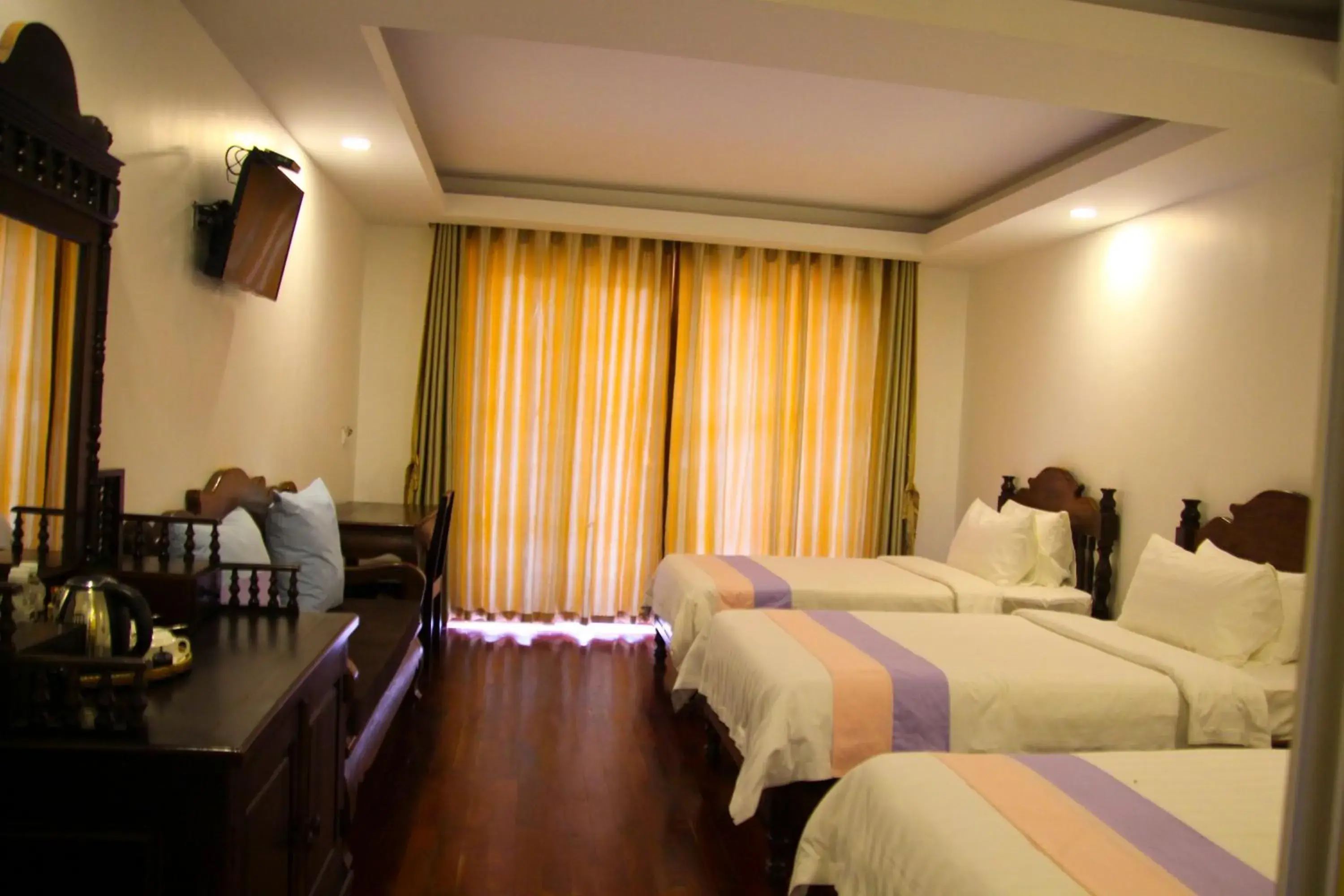 Bedroom in La Residence Watbo Hotel