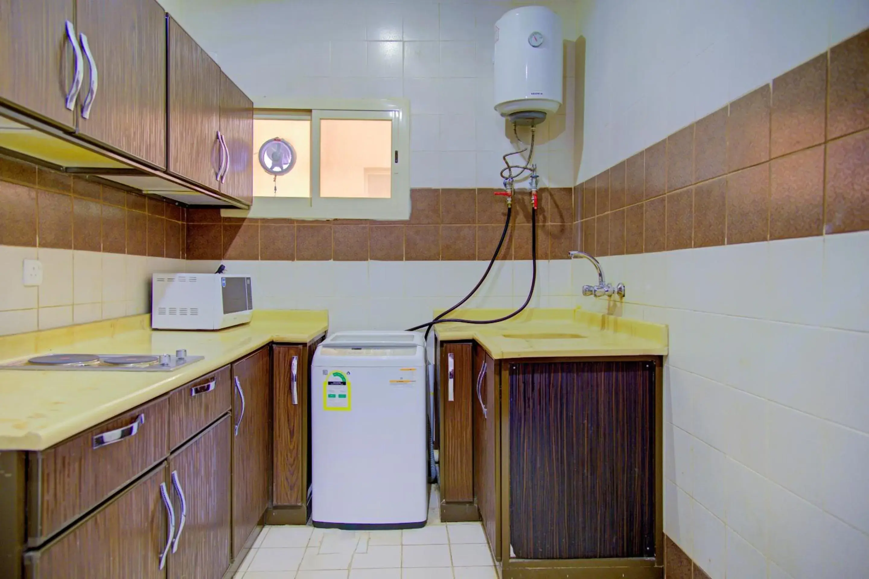 Kitchen or kitchenette, Kitchen/Kitchenette in OYO 401 Al Zaidan For Furnished Units