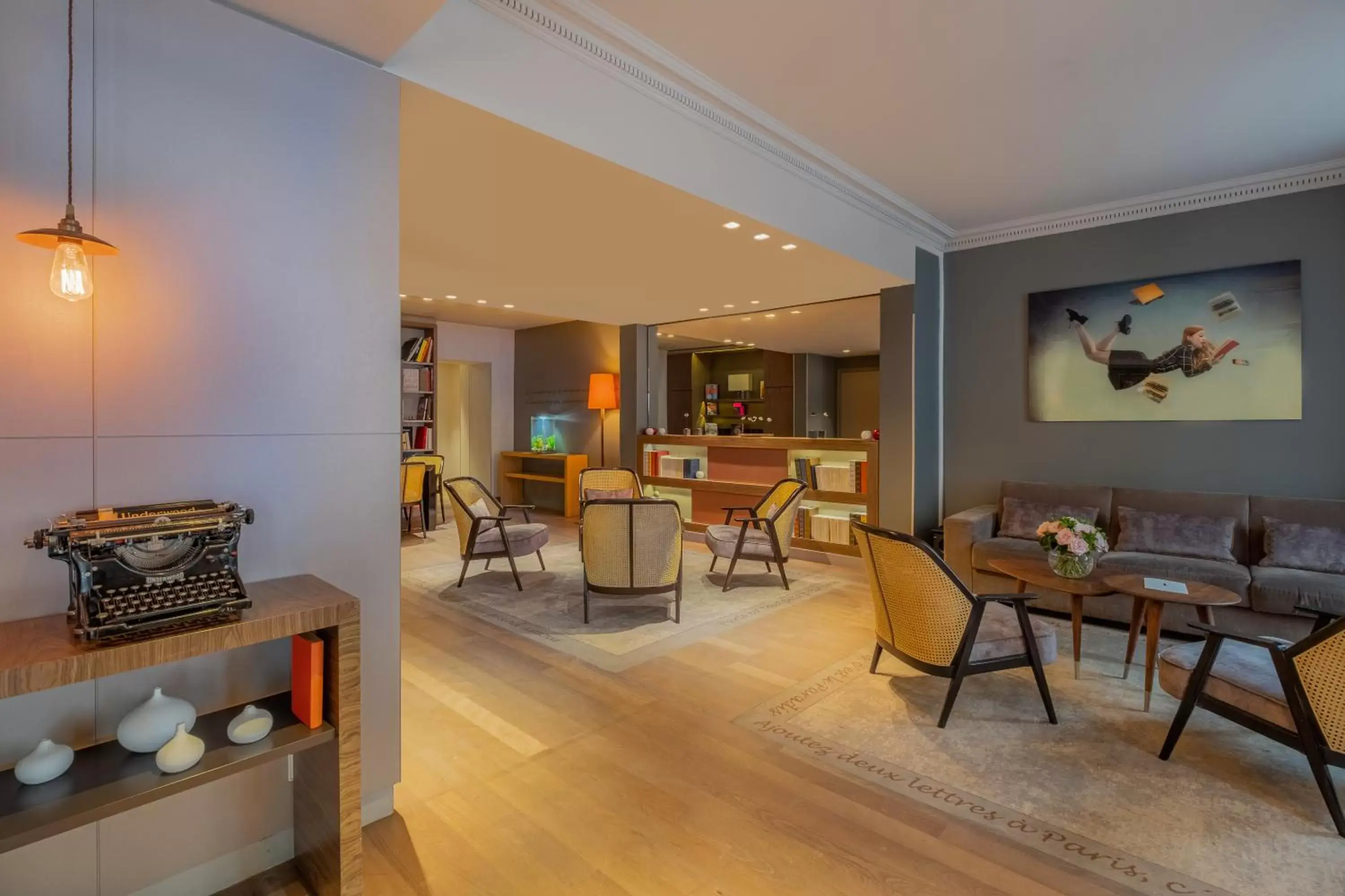 Lobby or reception in Hôtel Le Tourville by Inwood Hotels