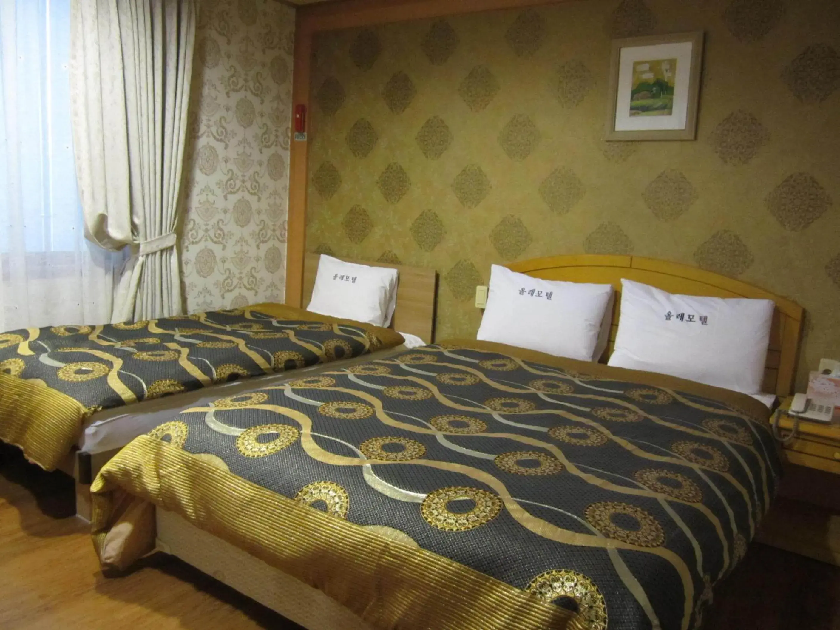 Bed in Jeju Olle Hotel