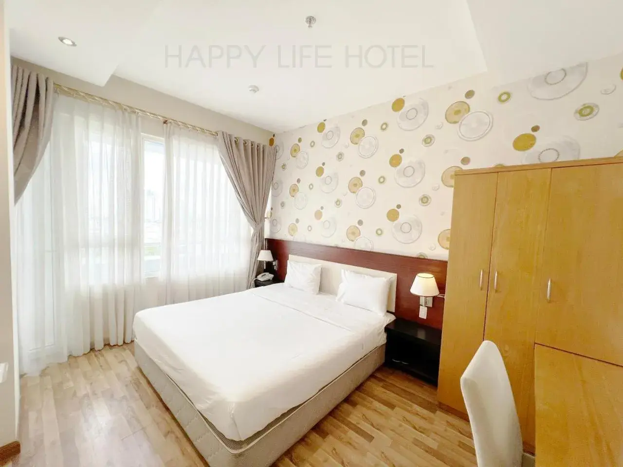 Bed in Happy Life Hotel