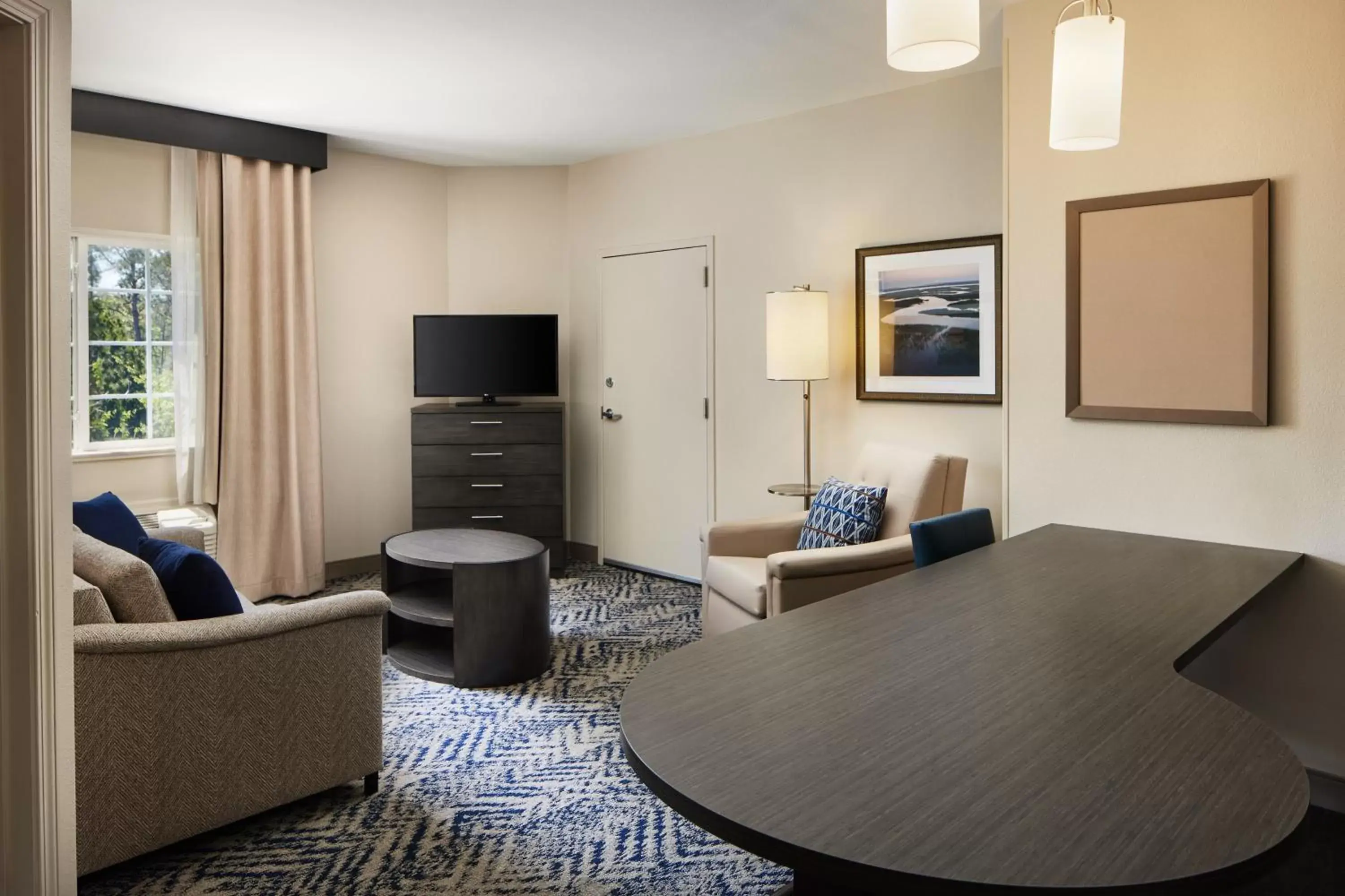 Photo of the whole room, Seating Area in Candlewood Suites I-26 @ Northwoods Mall, an IHG Hotel