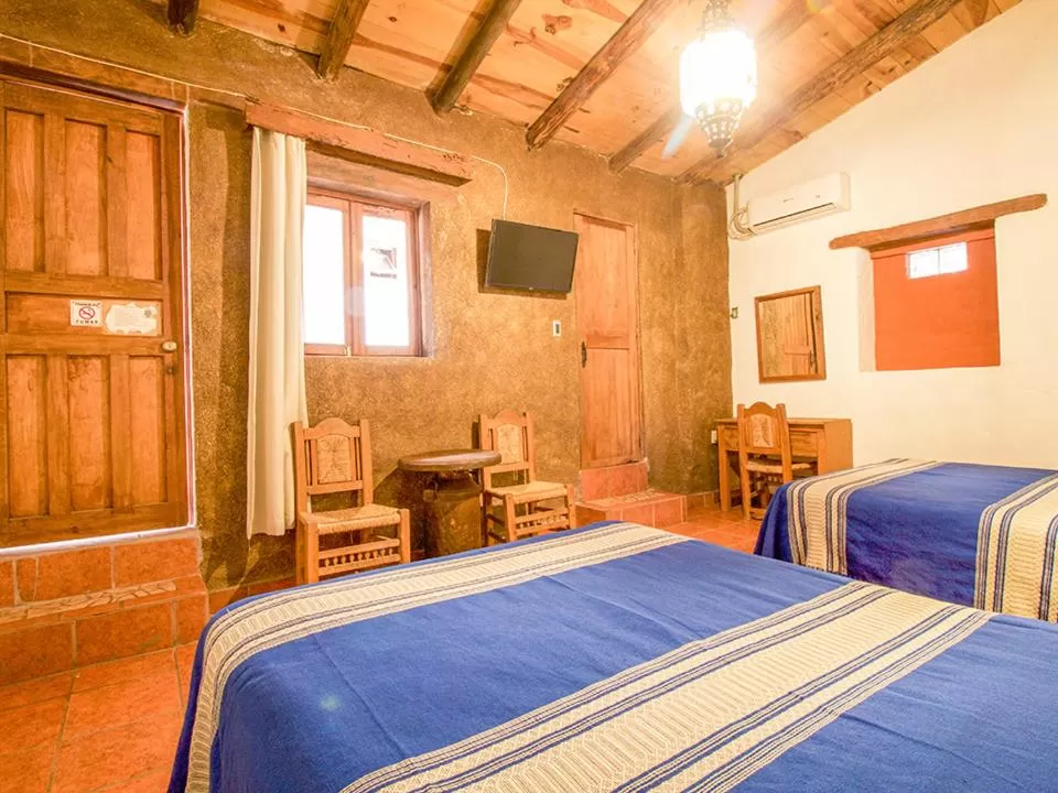 Photo of the whole room, Bed in Hotel Mi Pueblito Tapalpa