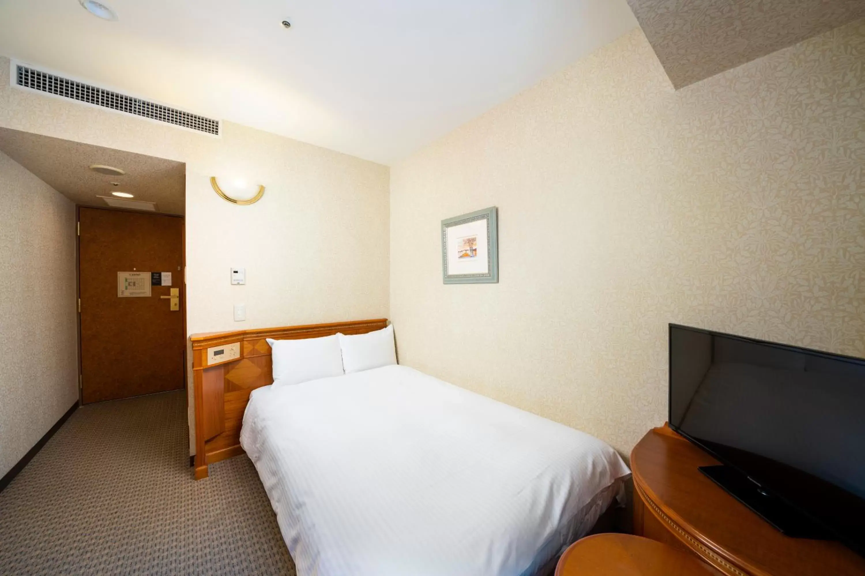 Bed in KOKO Hotel Nagoya Sakae