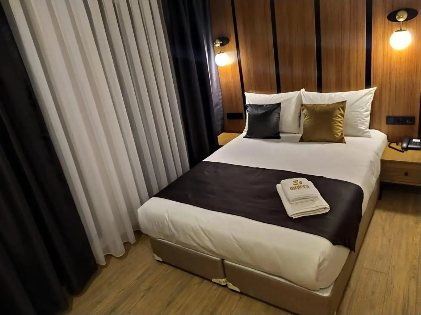 Bed in NUPERA HOTEL