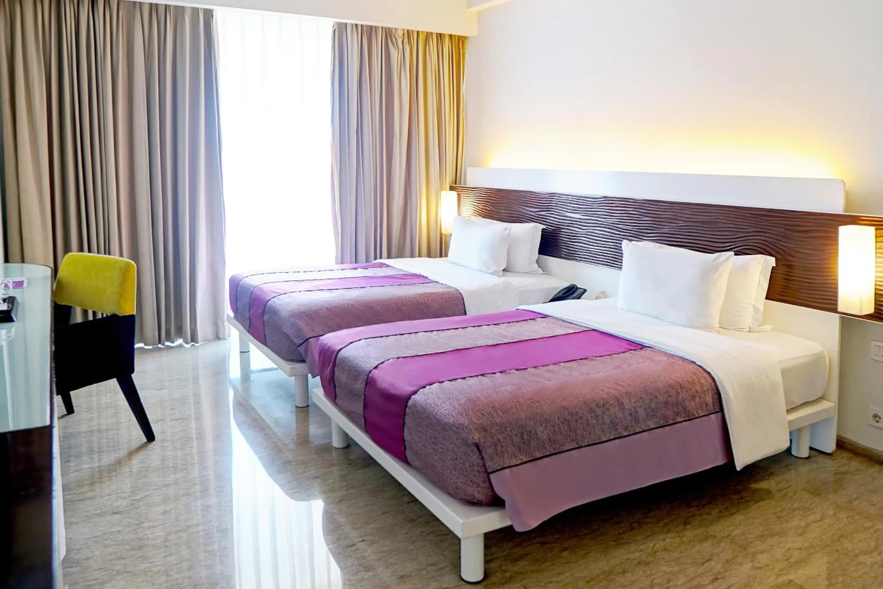 Photo of the whole room, Bed in Sensa Hotel Bandung