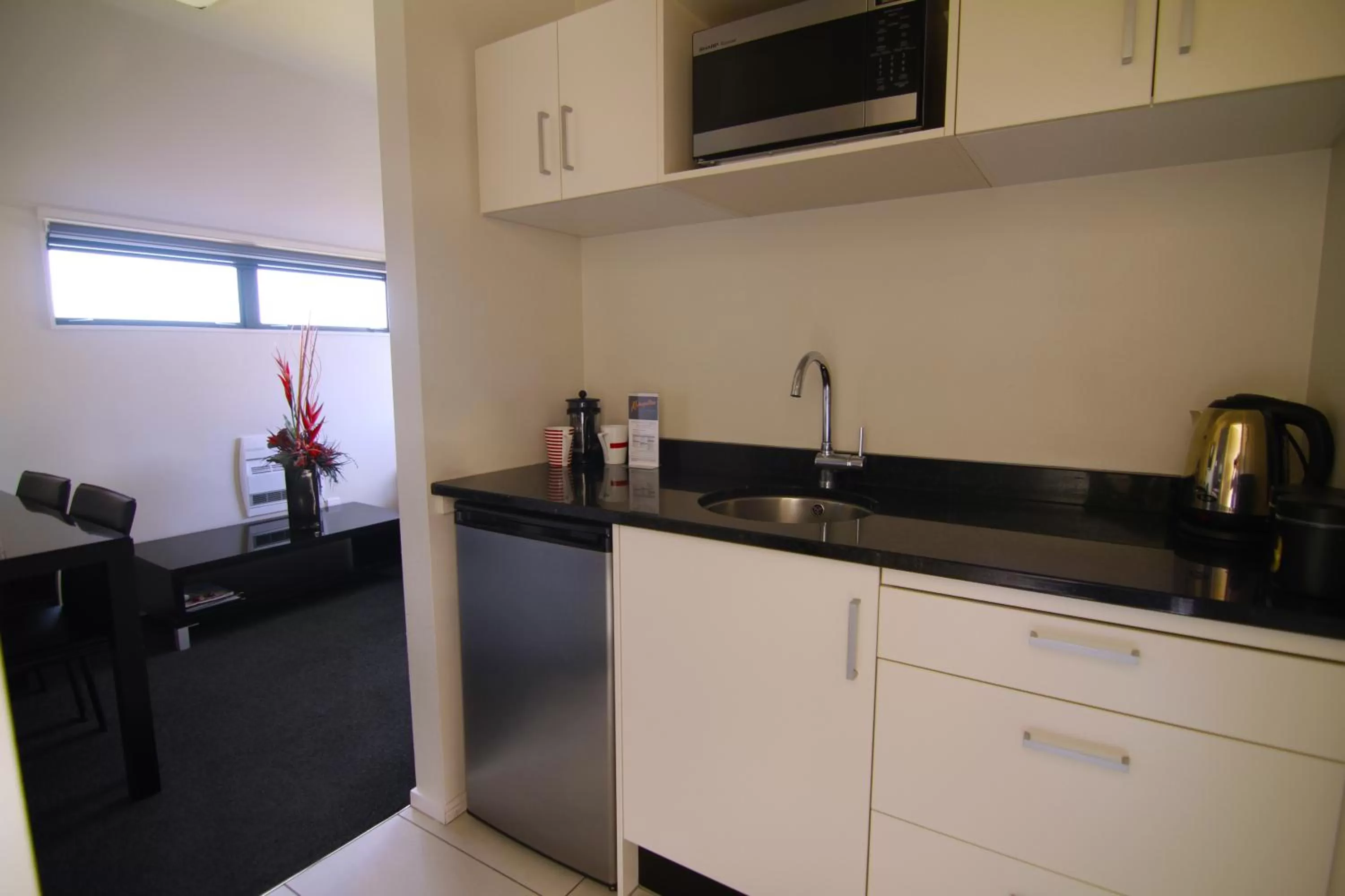 Kitchen or kitchenette in Metropolitan Motel on Riccarton - 2 mins walk to Westfield