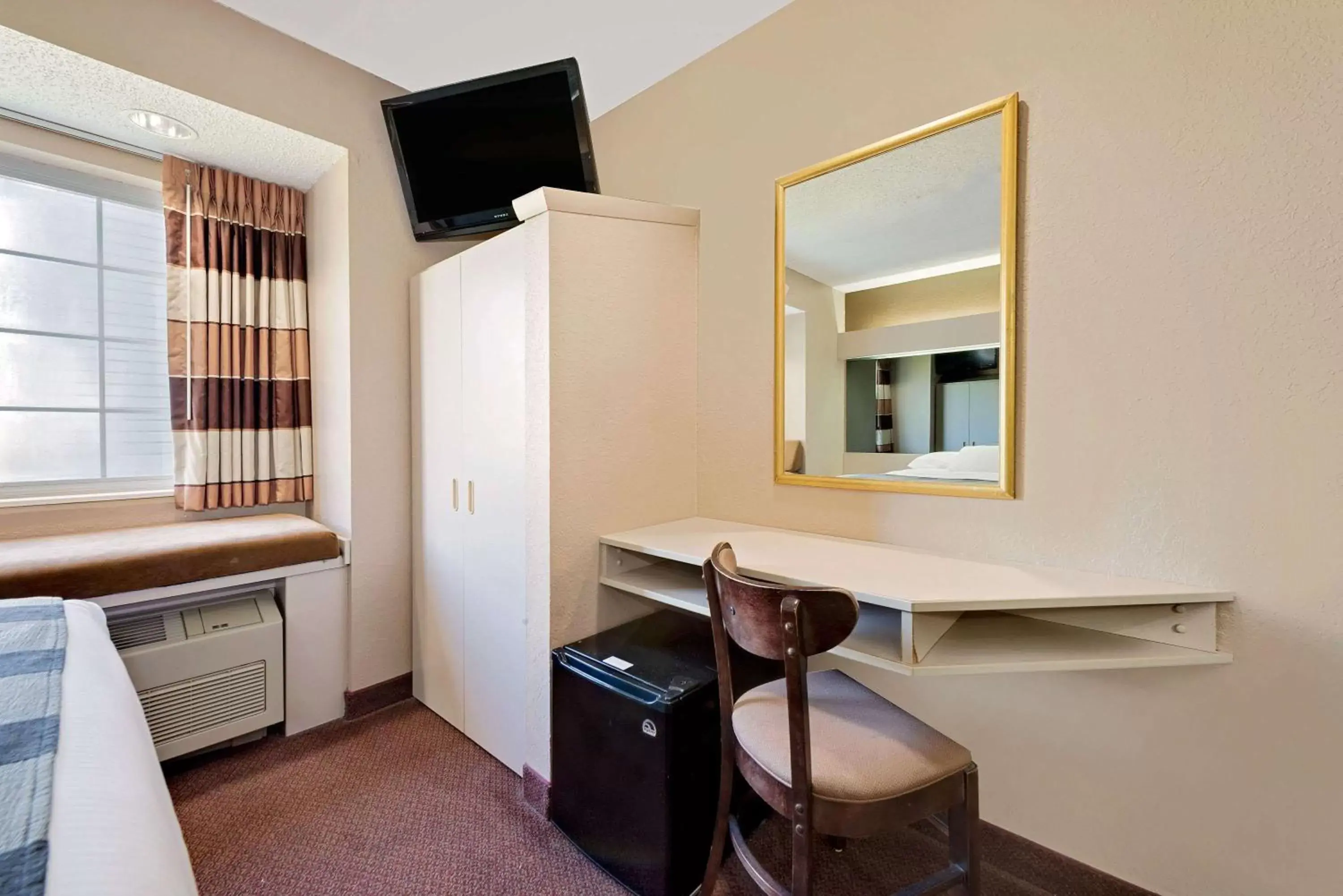 Photo of the whole room, TV/Entertainment Center in Microtel Inn & Suites by Wyndham Joplin