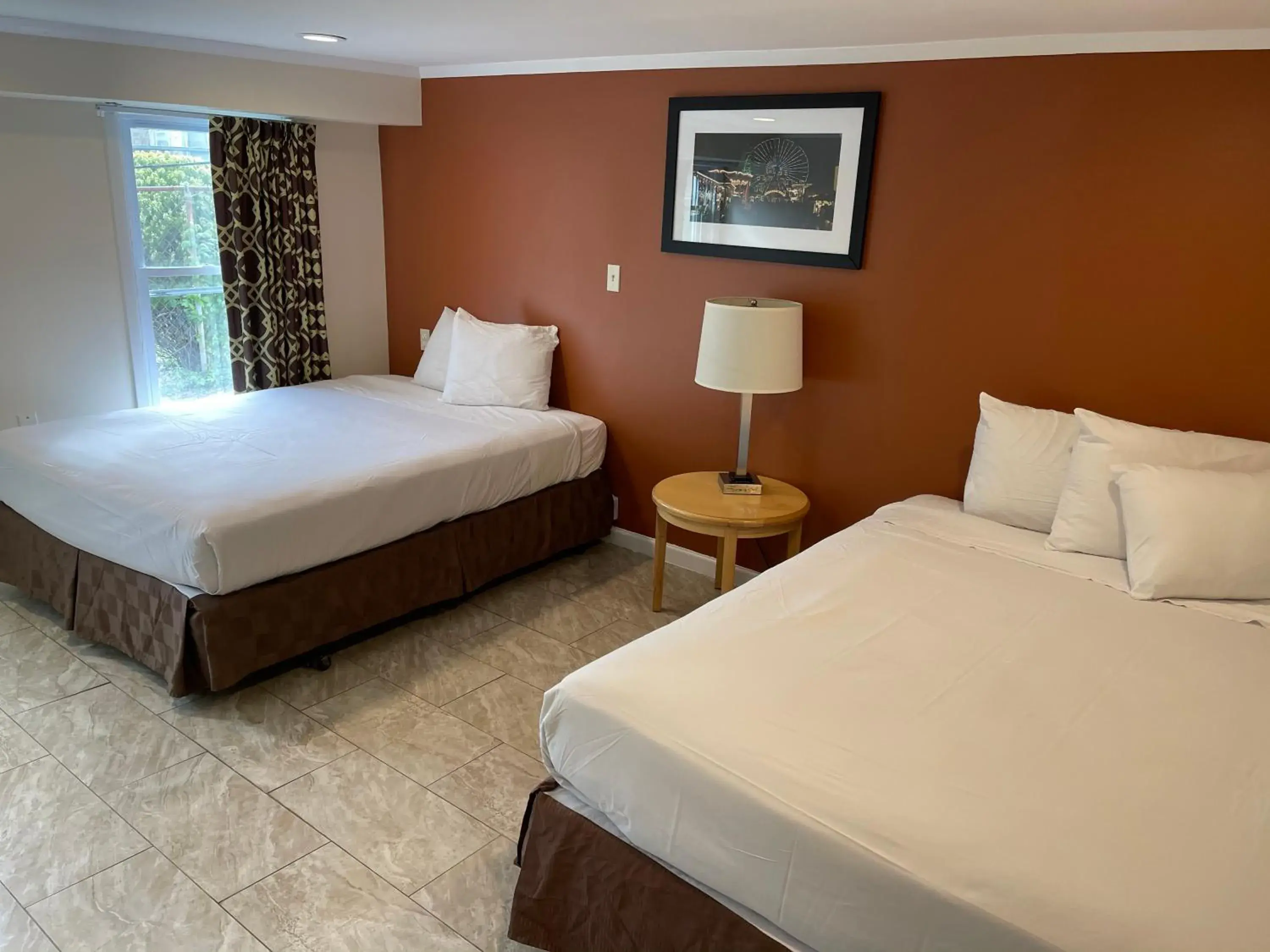 Bed in Wildwood Inn, a Travelodge by Wyndham