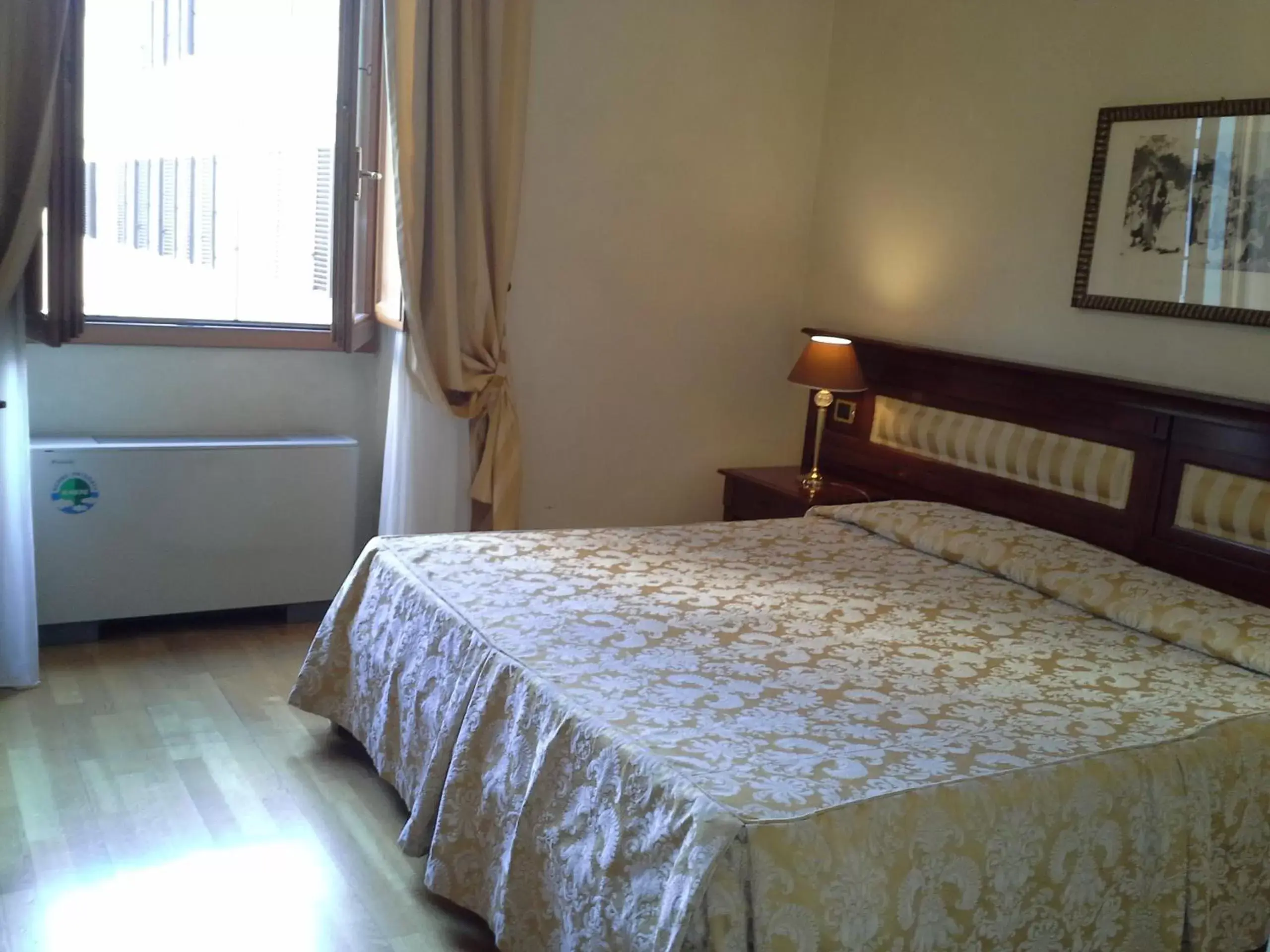Bed in Hotel Bigallo