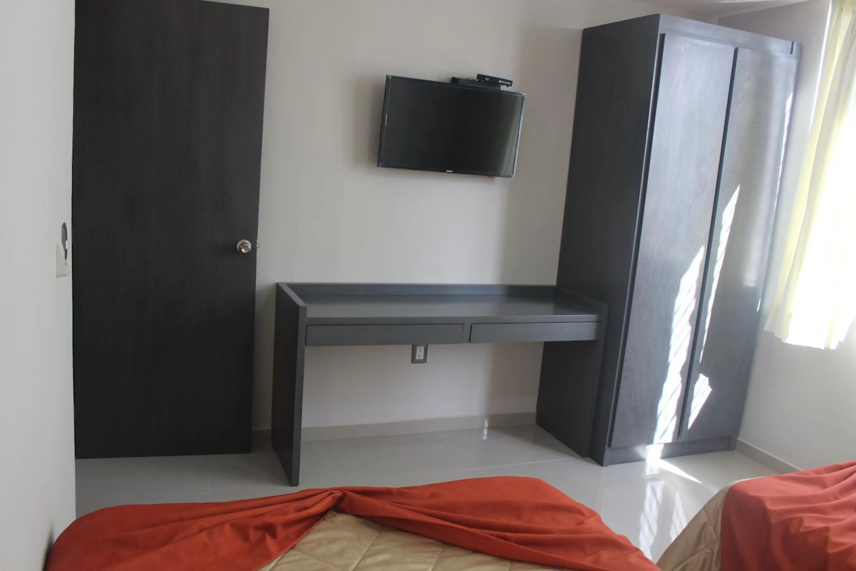 Bedroom, TV/Entertainment Center in Suites San Luis