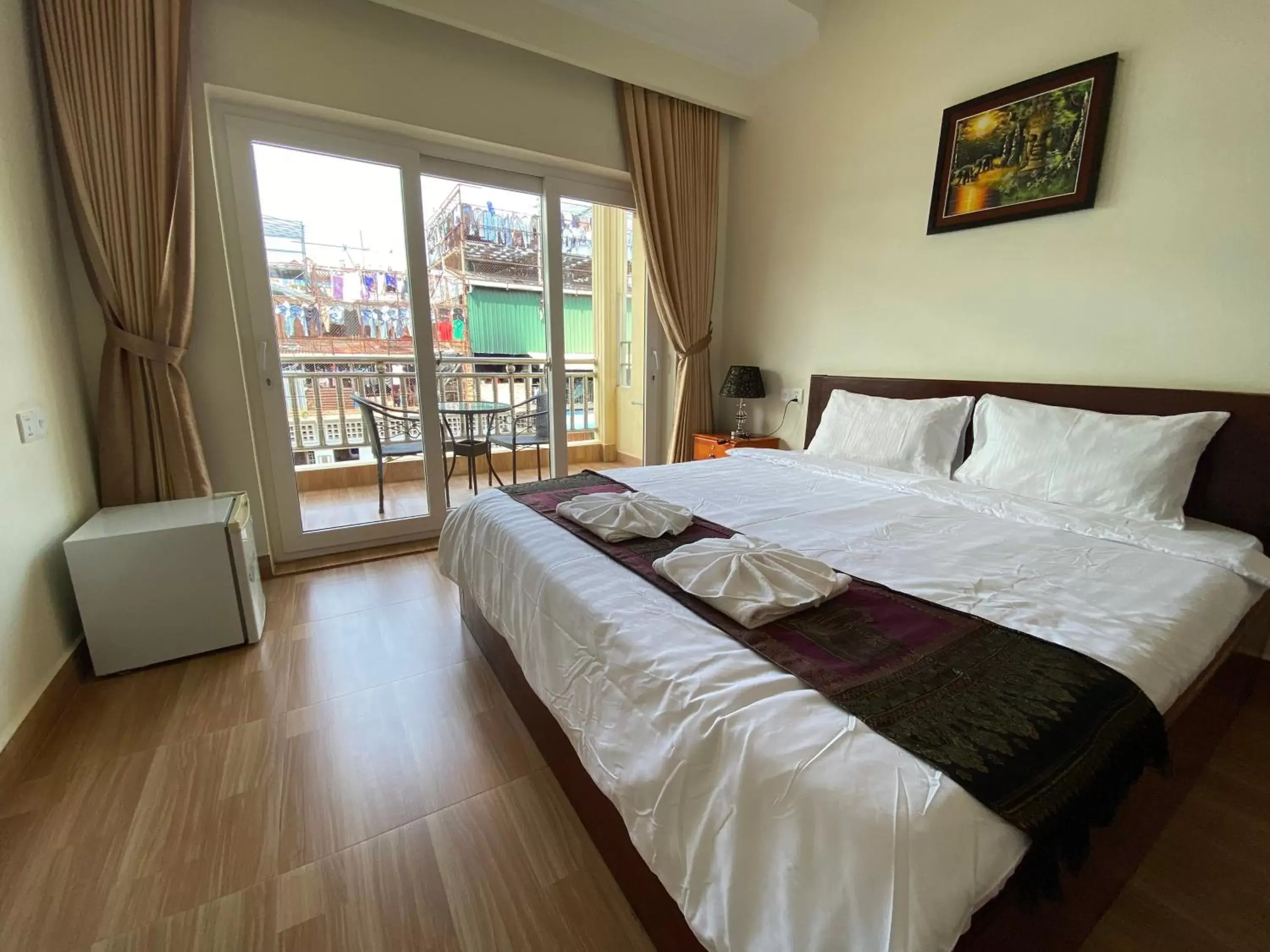 Photo of the whole room, Bed in Phnom Penh Le Vincent Hotel