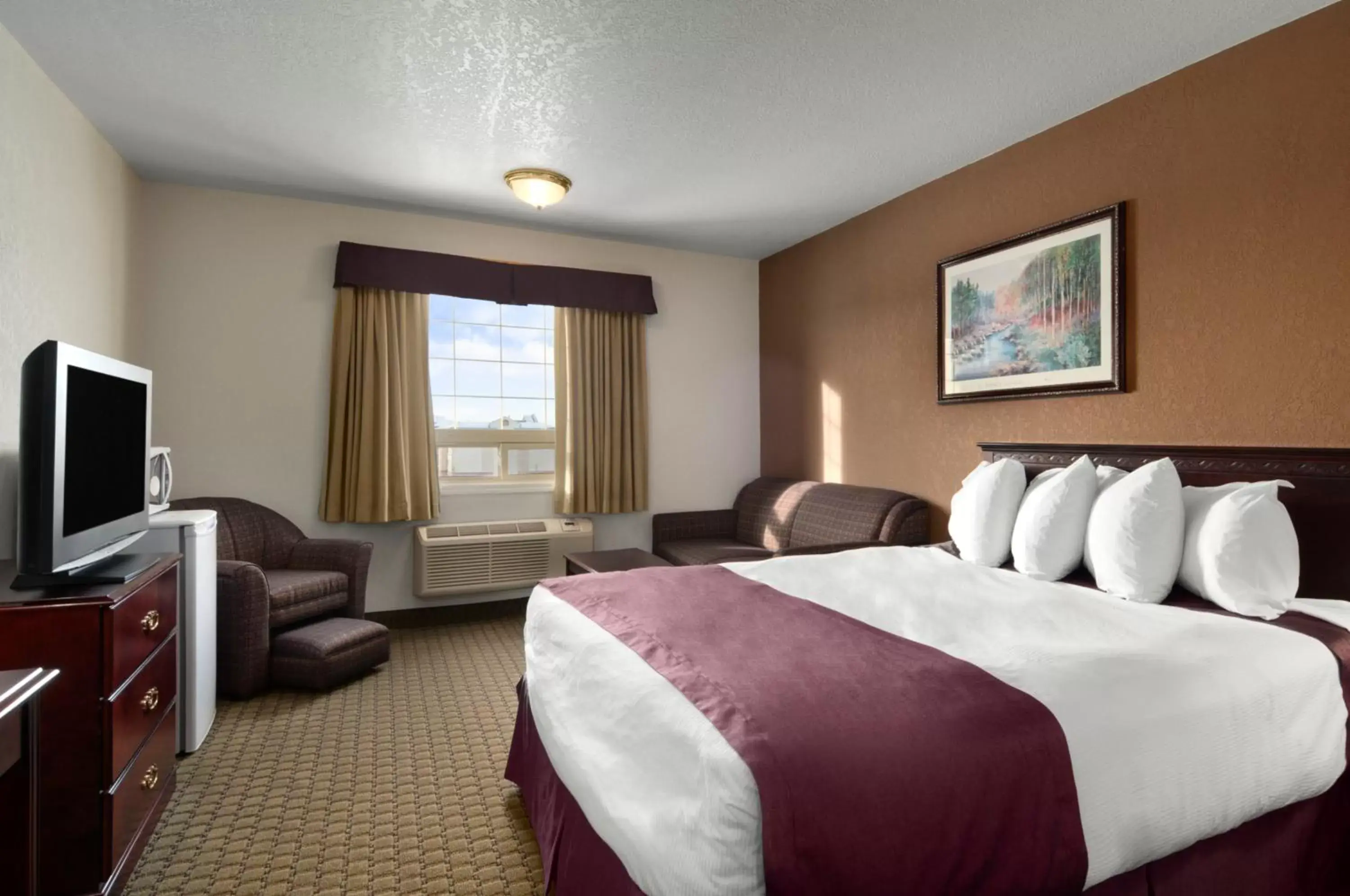 Photo of the whole room in Ramada by Wyndham Red Deer Hotel & Suites