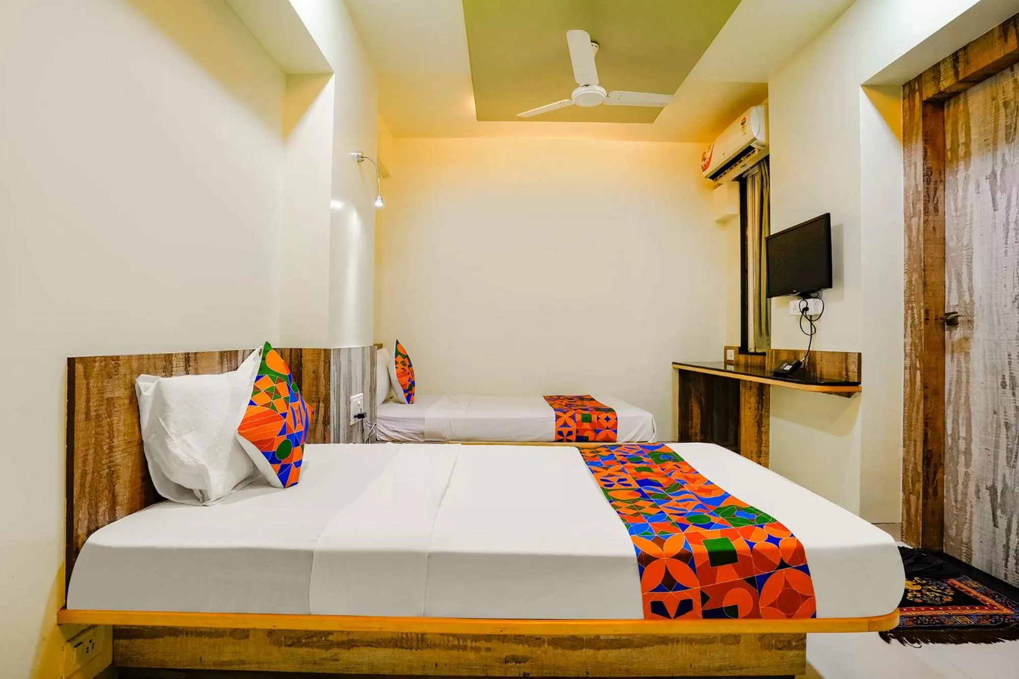 Communal lounge/ TV room, Bed in FabHotel Happy Homely Stay - Airport road