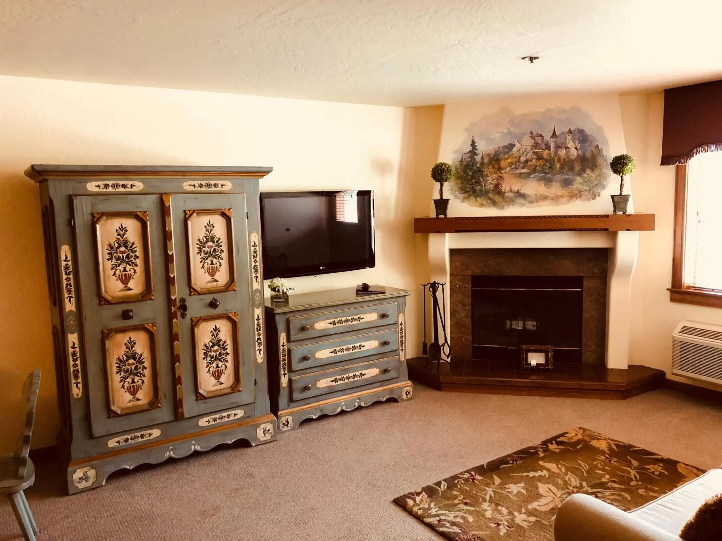 Decorative detail, TV/Entertainment Center in Enzian Inn