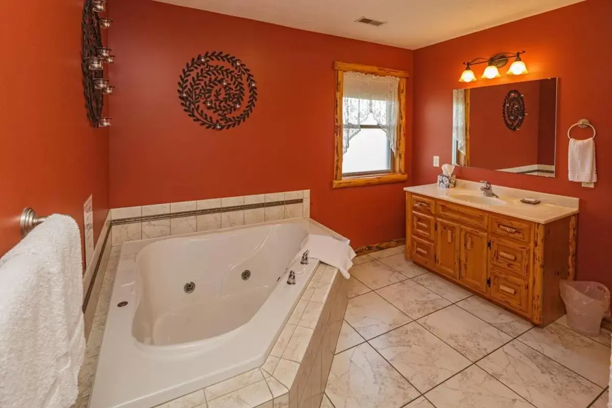 Bathroom in Sojourner's Lodge & Log Cabin Suites