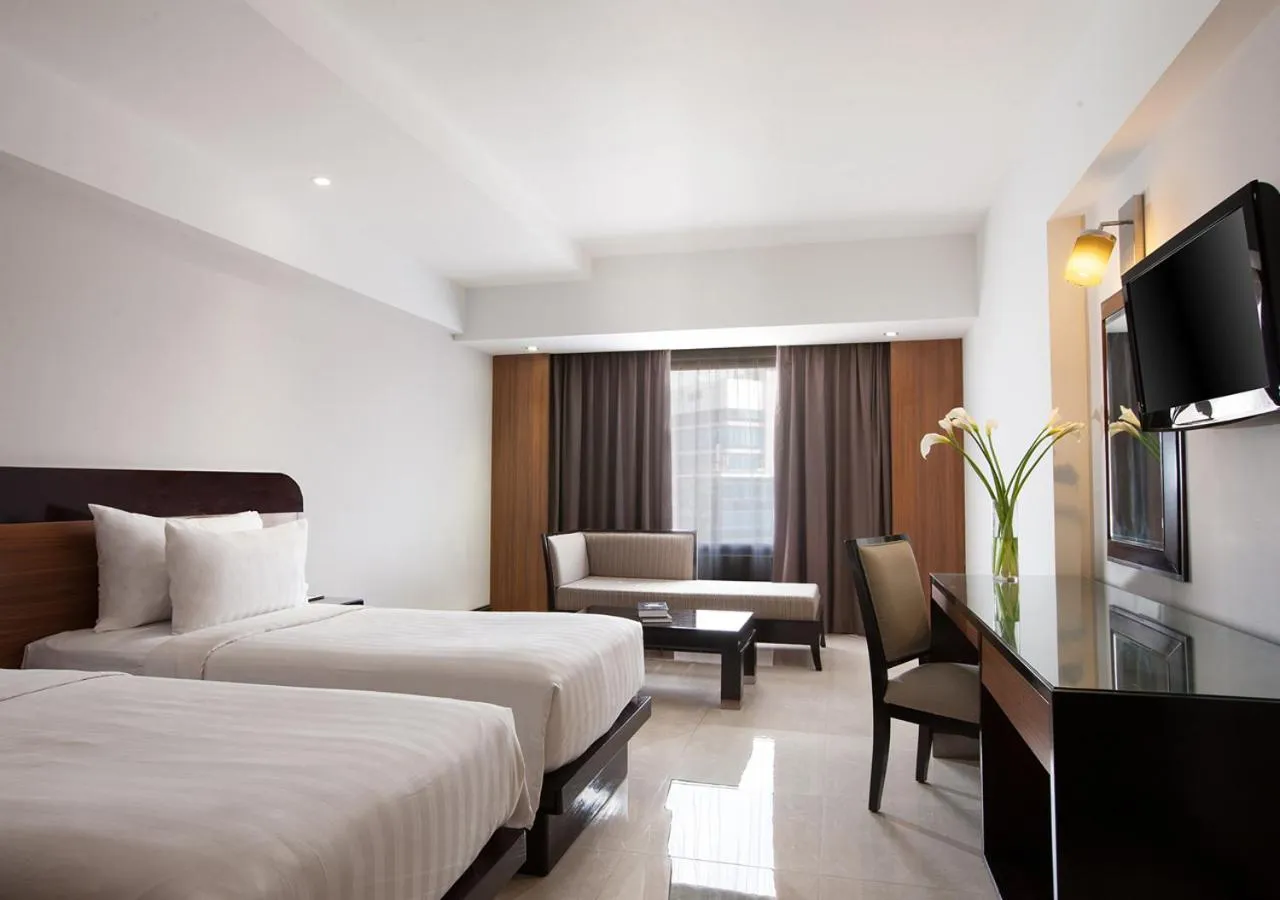 Photo of the whole room, Bed in Hotel Santika Premiere Semarang