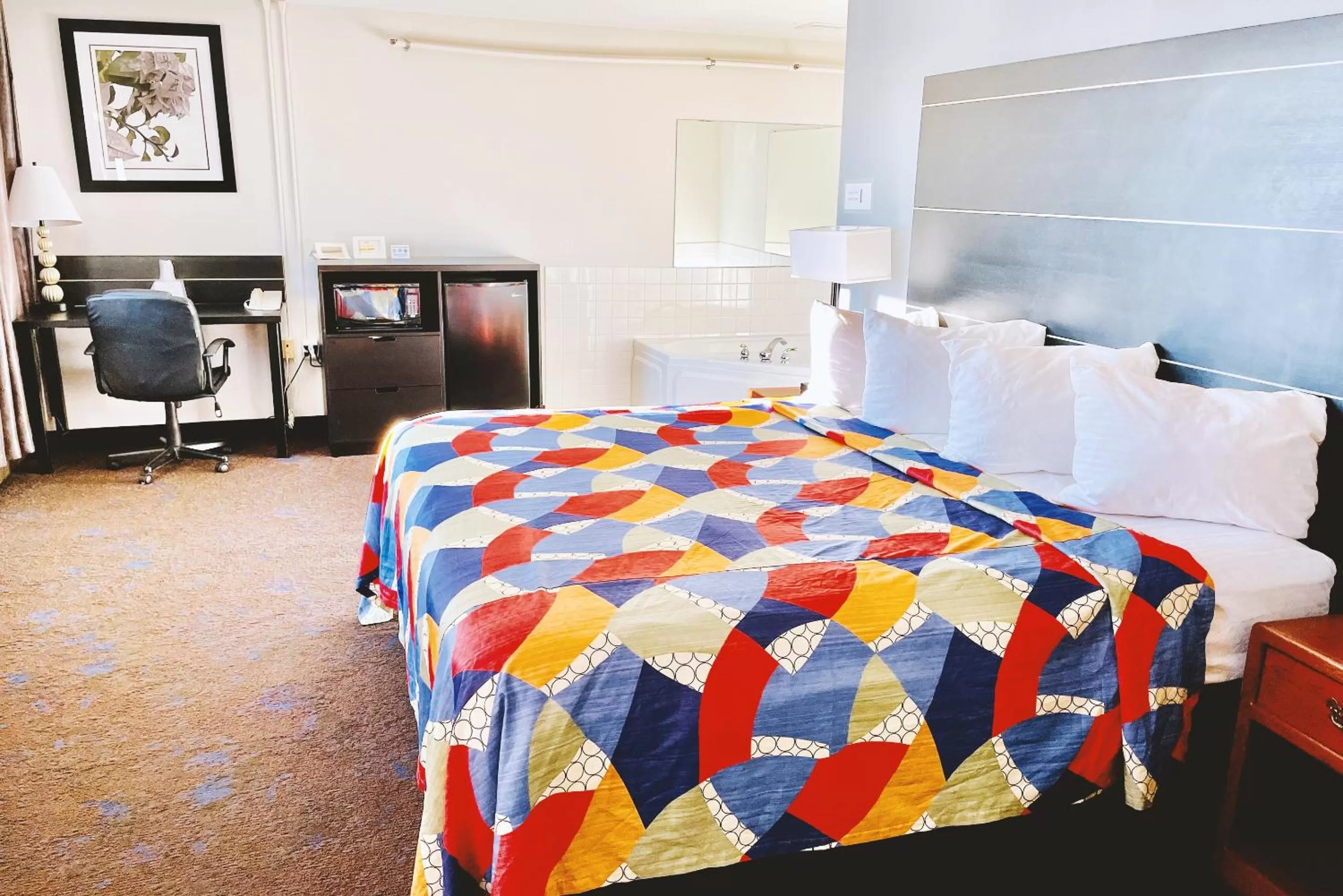 Bed in Coratel Inn & Suites by Jasper Northfield