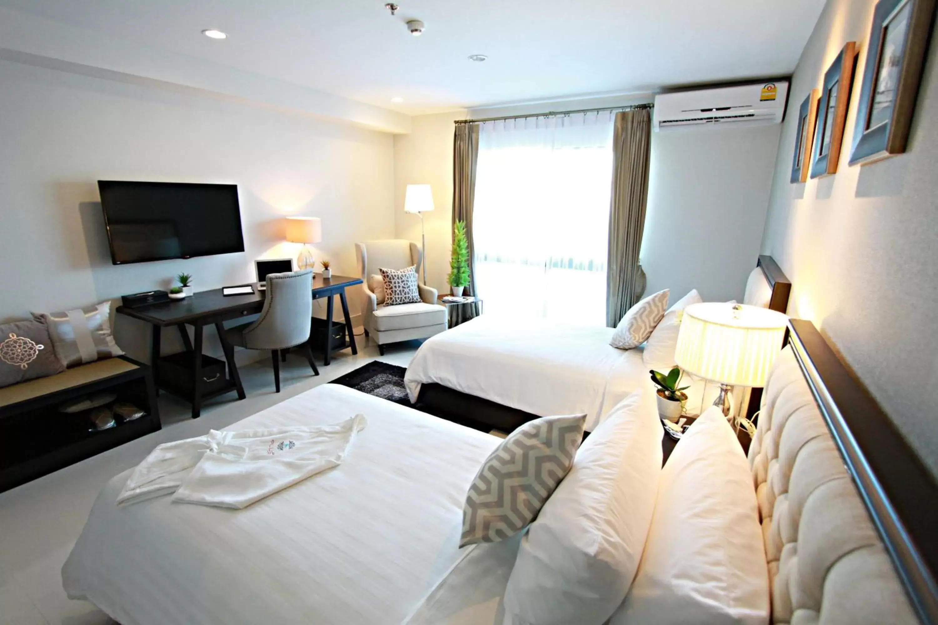 Photo of the whole room in SN Plus Hotel - SHA Plus