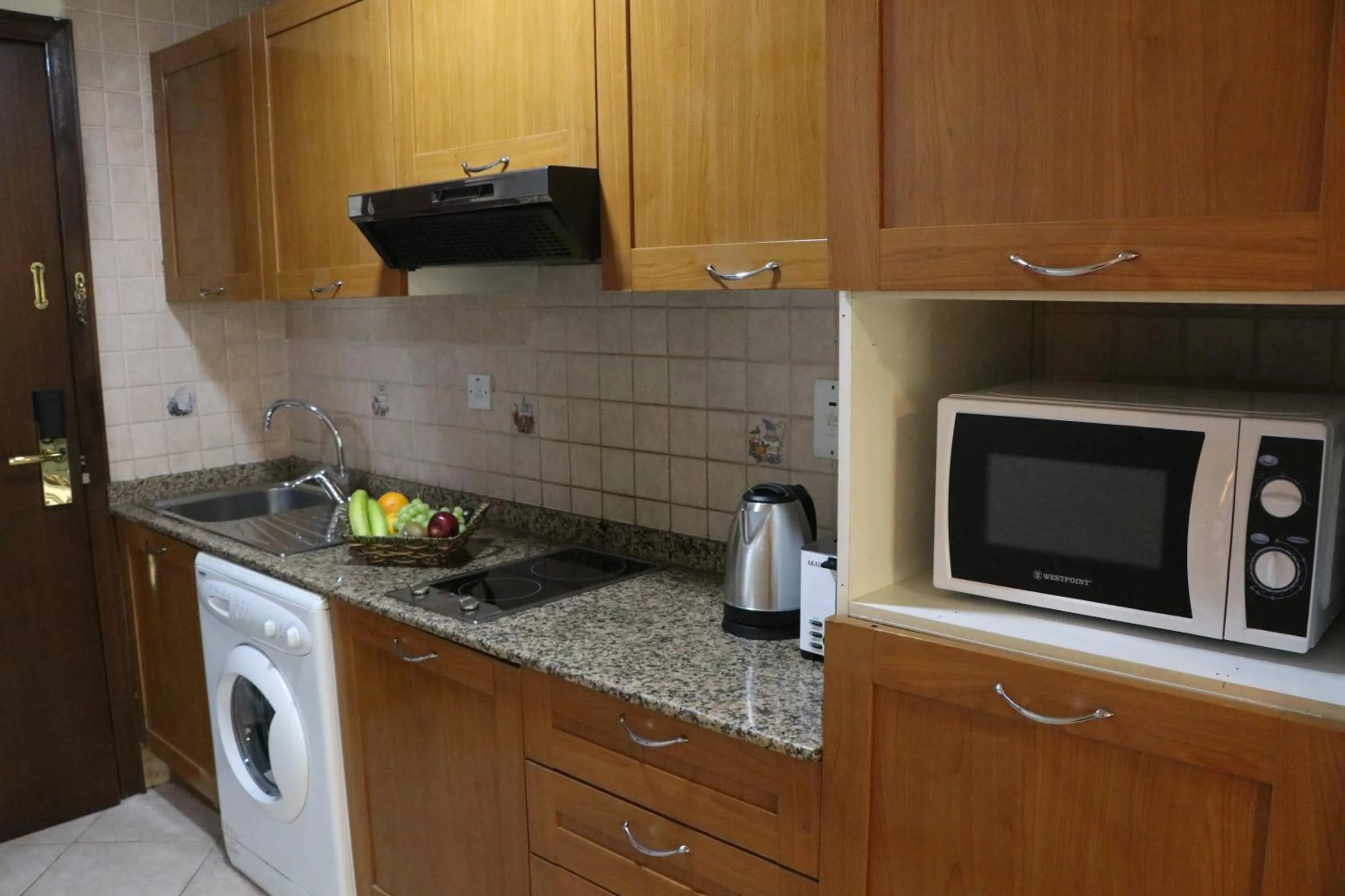 Kitchen or kitchenette in Al Manar Grand Hotel Apartment
